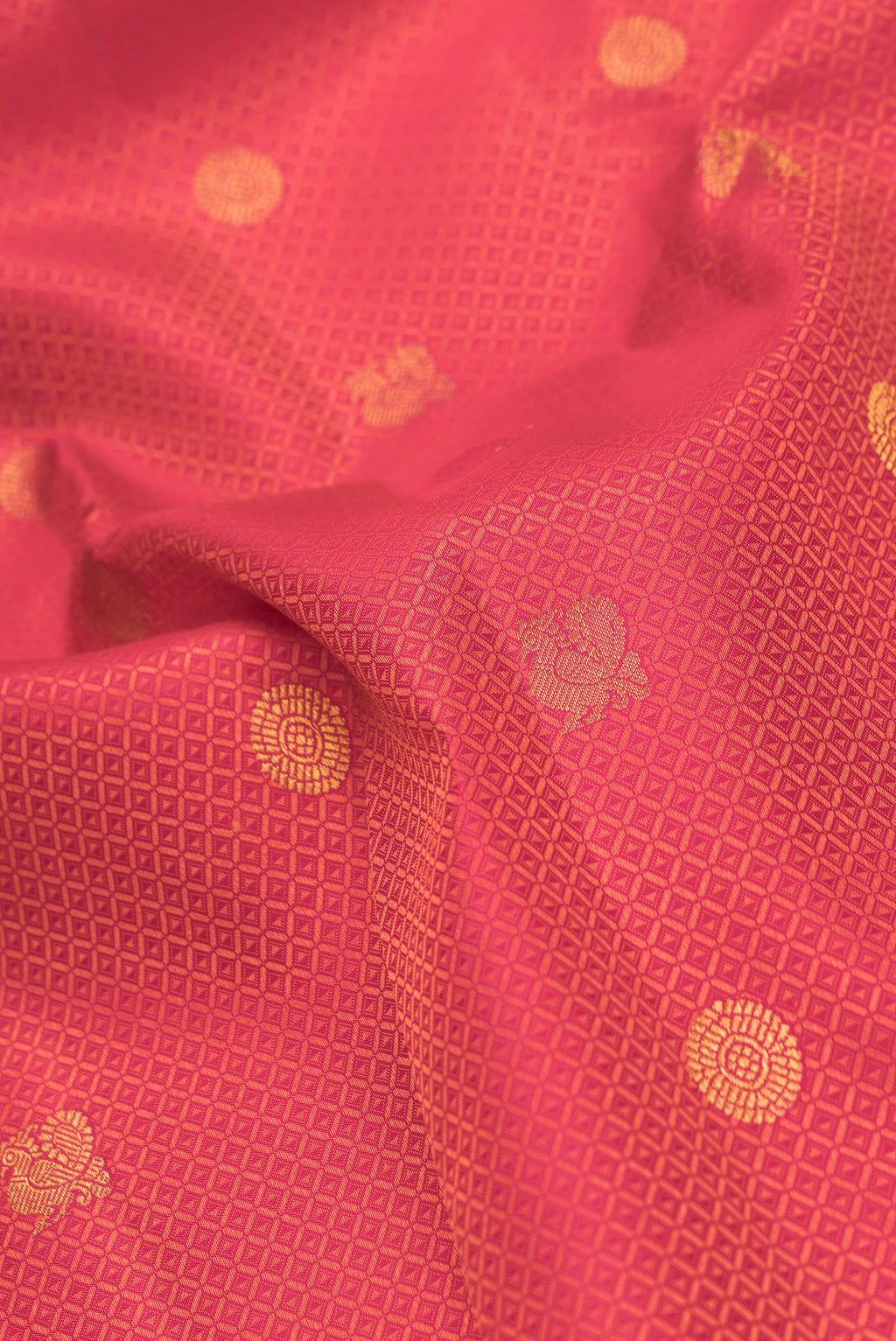 Close up of Red Dual Tone Kanchipuram Silk Saree with Jacquard With Zari Butta on the body and Zari Border.  displaying folds