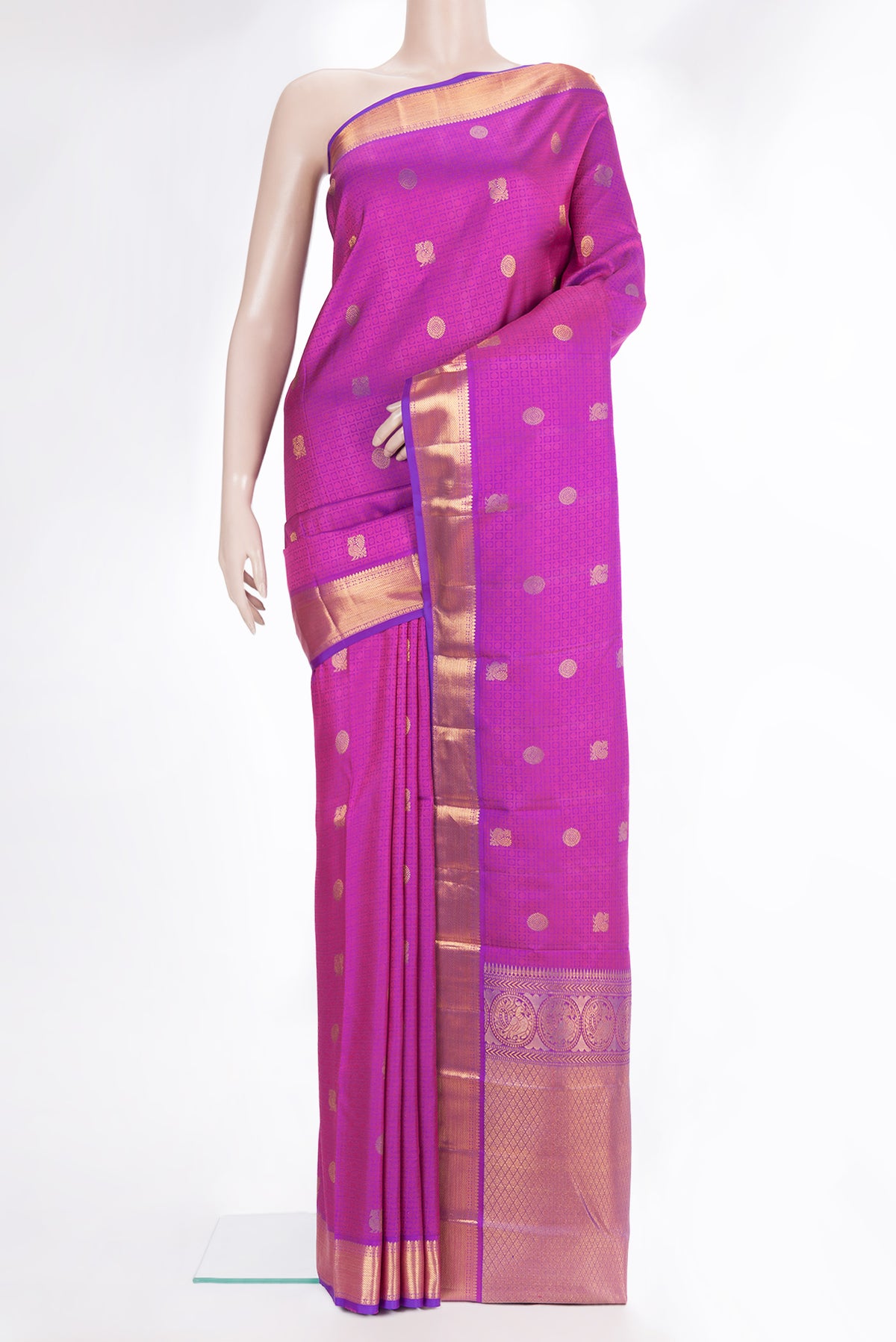 Pure Silk Magenta Kanchipuram Saree with Jacquard With Thread Butta on the body and Zari Border.  displayed on a mannequin