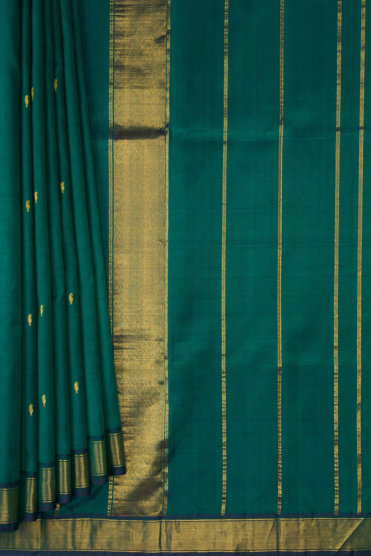 Pleats and pallu of Bottle Green Kanchipuram Silk Saree with Zari Butta on the body and Zari Border. 