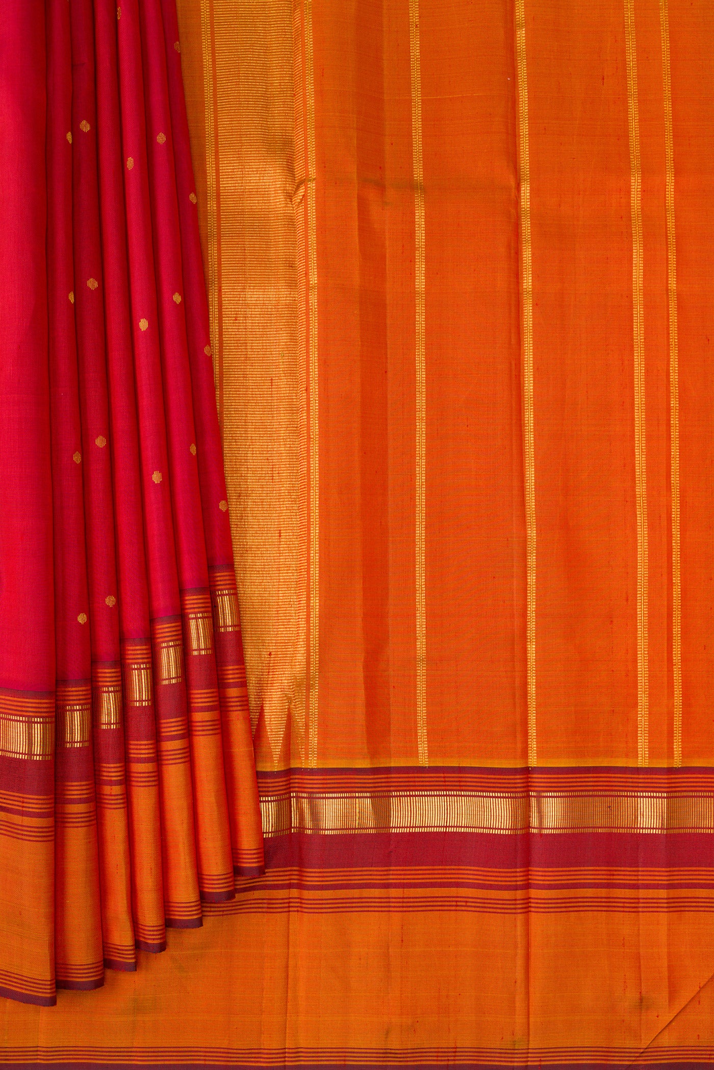 Pleats and pallu of Red Kanchipuram Silk Saree with Zari Butta on the body and Zari Border. 