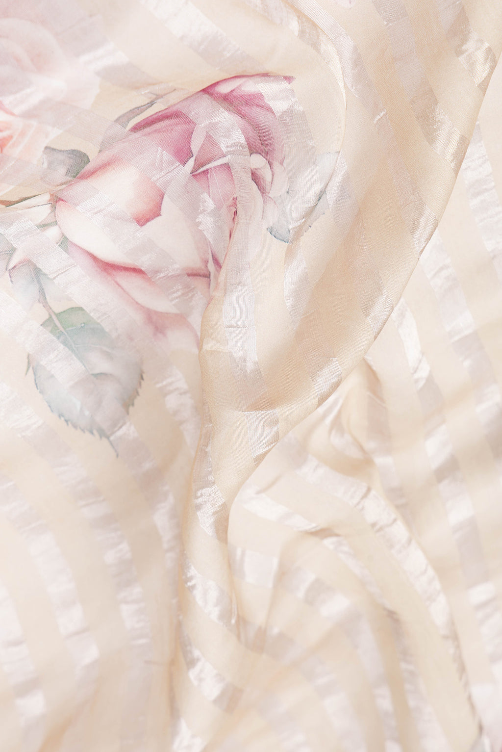 Close up of Beige Dual Tone Organza Silk Saree with Stripes on the body and Without Border.  displaying folds