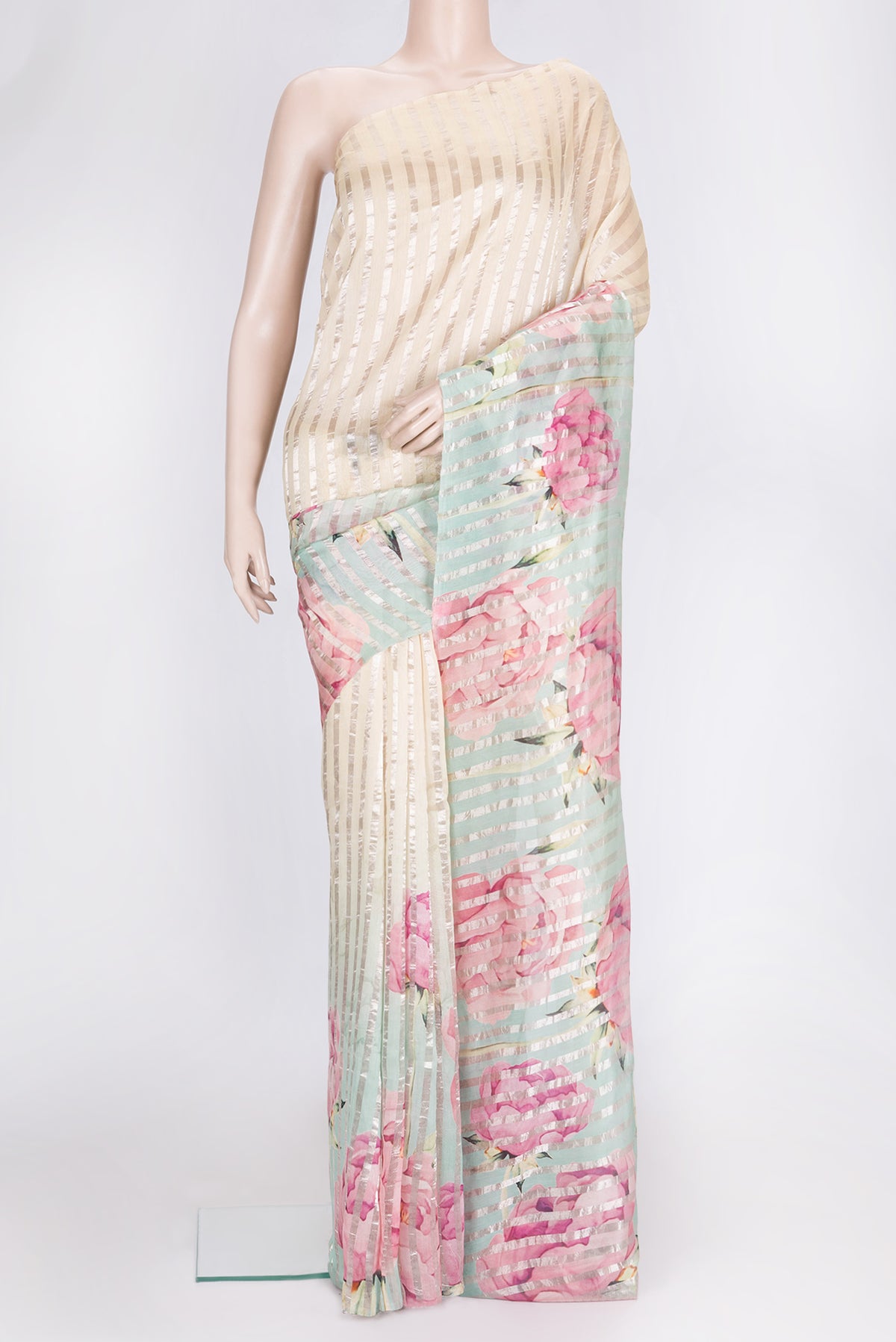 Beige and Green Color Organza Silk Saree with Stripes on the body and Without Border.  displayed on a mannequin