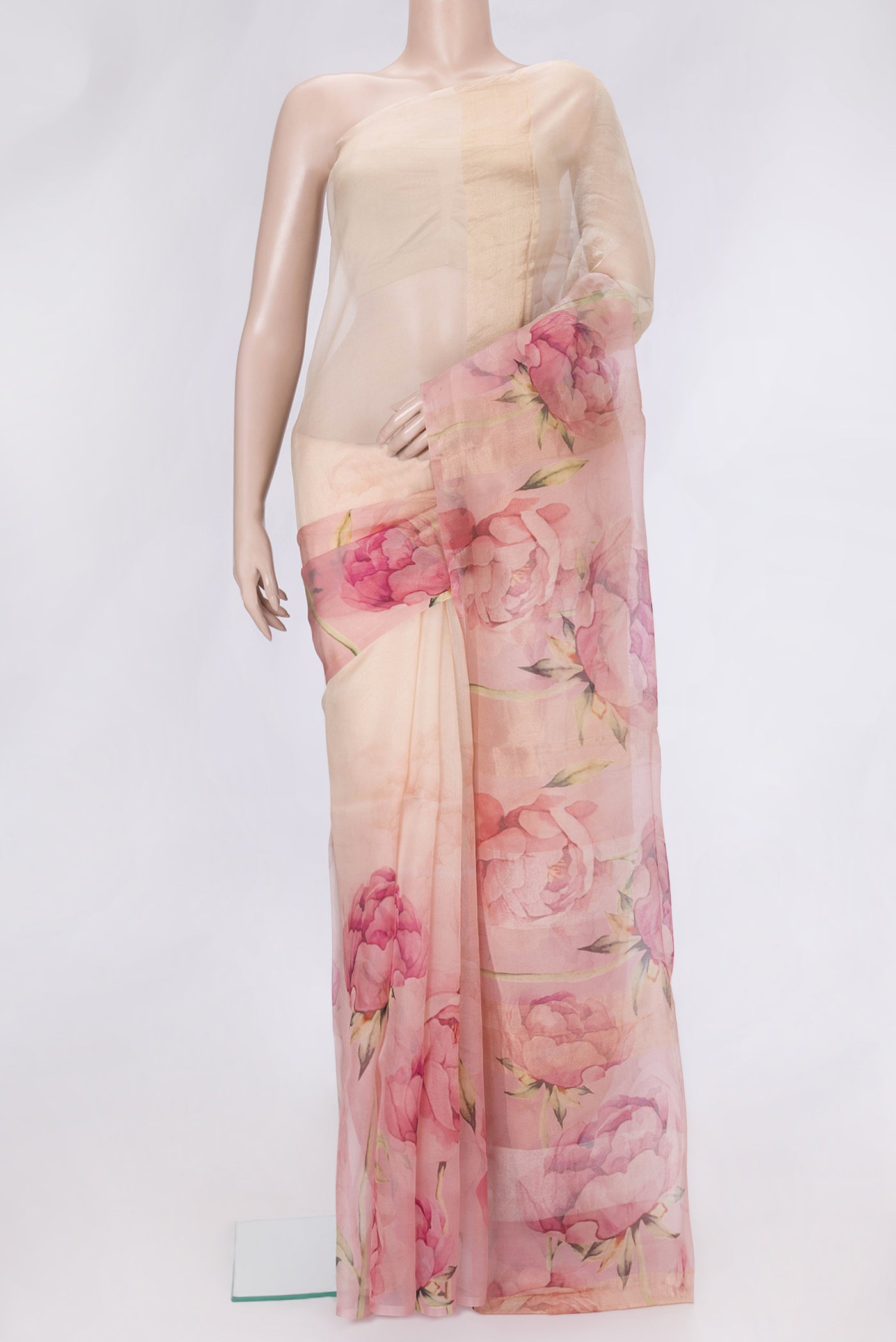 Golden Peach Dual Tone Organza Silk Saree with Printed design on the body and Without Border.  displayed on a mannequin