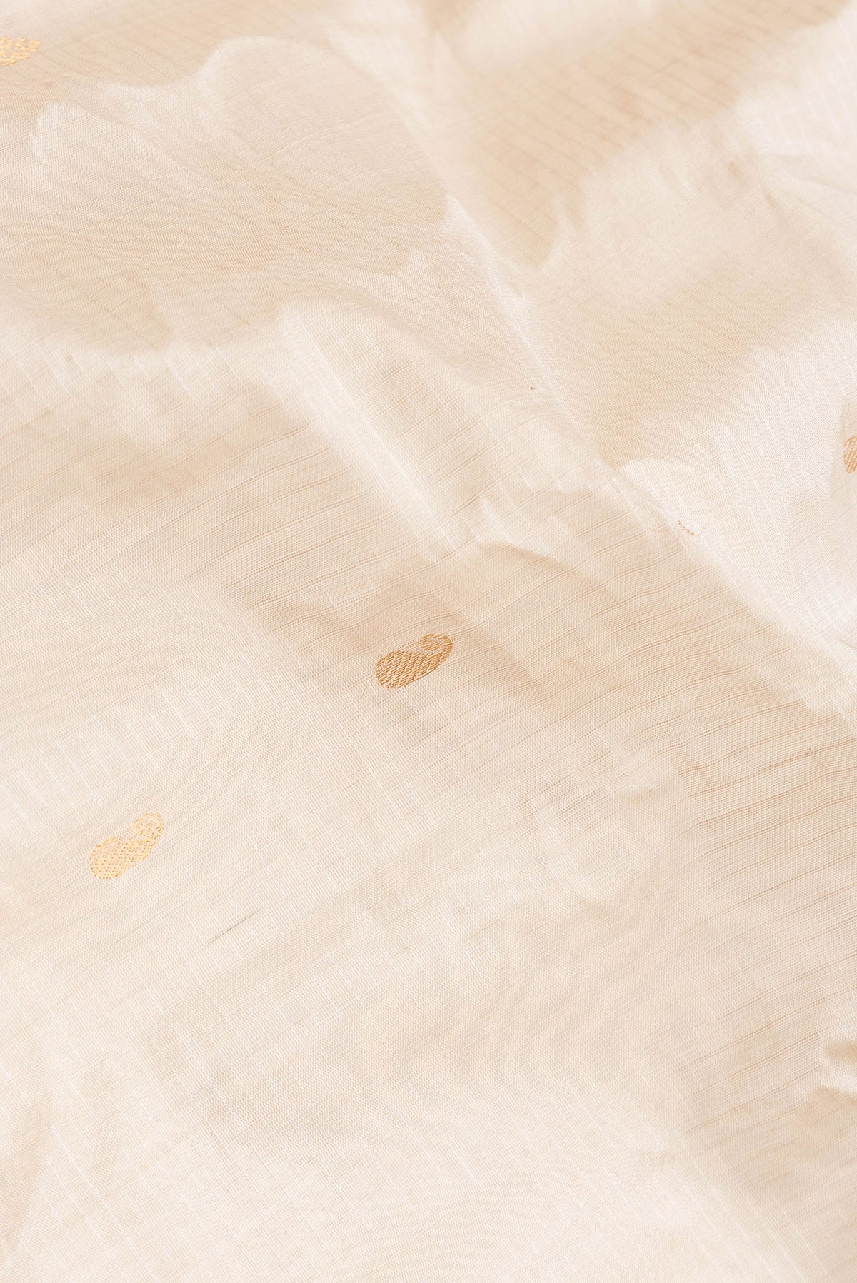 Close up of Beige Dual Tone Gadwal Silk Saree with Zari Butta on the body and Zari Border.  displaying folds