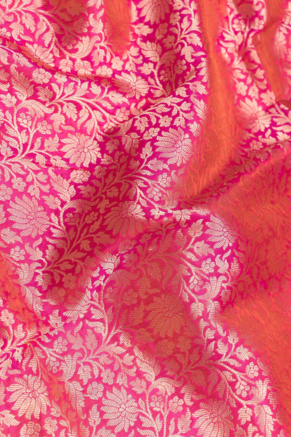 Close up of Pink Dual Tone Banarasi Silk Saree with Zari Brocade on the body and Zari Border.  displaying folds