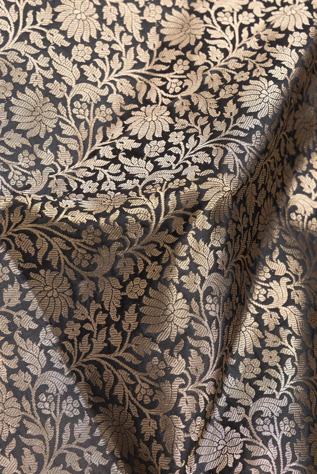 Close up of Black Dual Tone Banarasi Silk Saree with Zari Brocade on the body and Zari Border.  displaying folds
