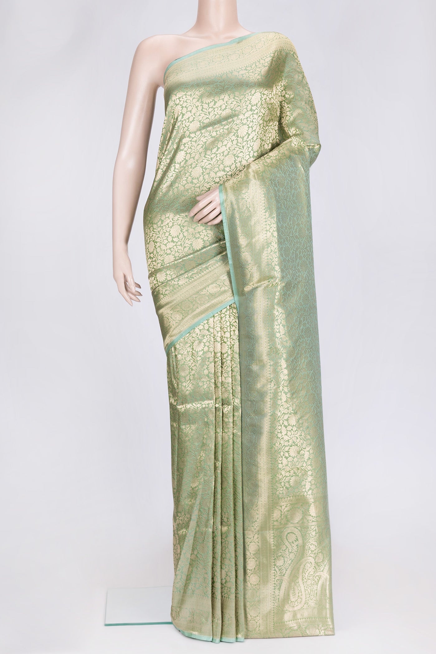 Sea Green Dual Tone Banarasi Silk Saree with Zari Brocade on the body and Zari Border.  displayed on a mannequin