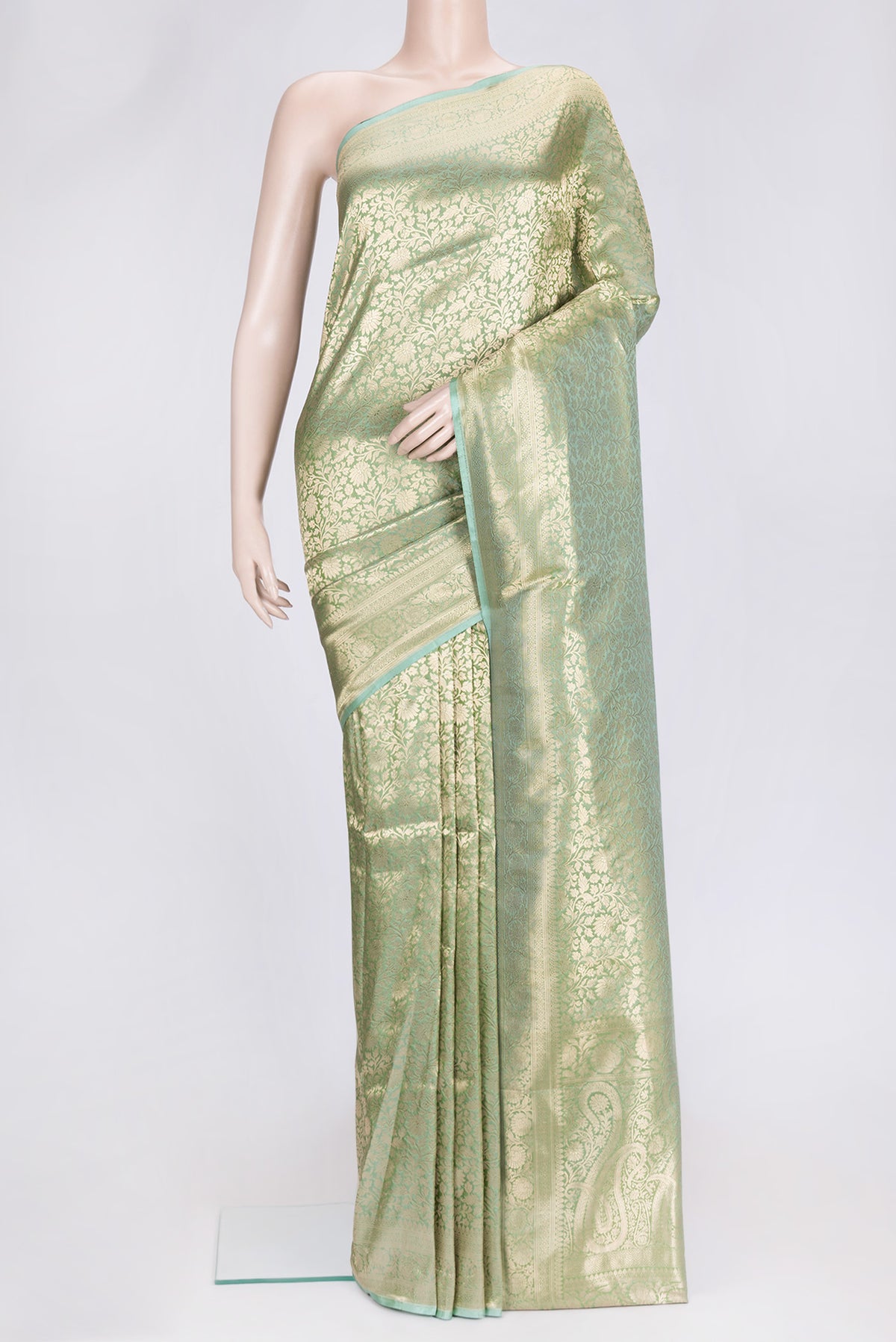 Sea Green Dual Tone Banarasi Silk Saree with Zari Brocade on the body and Zari Border.  displayed on a mannequin
