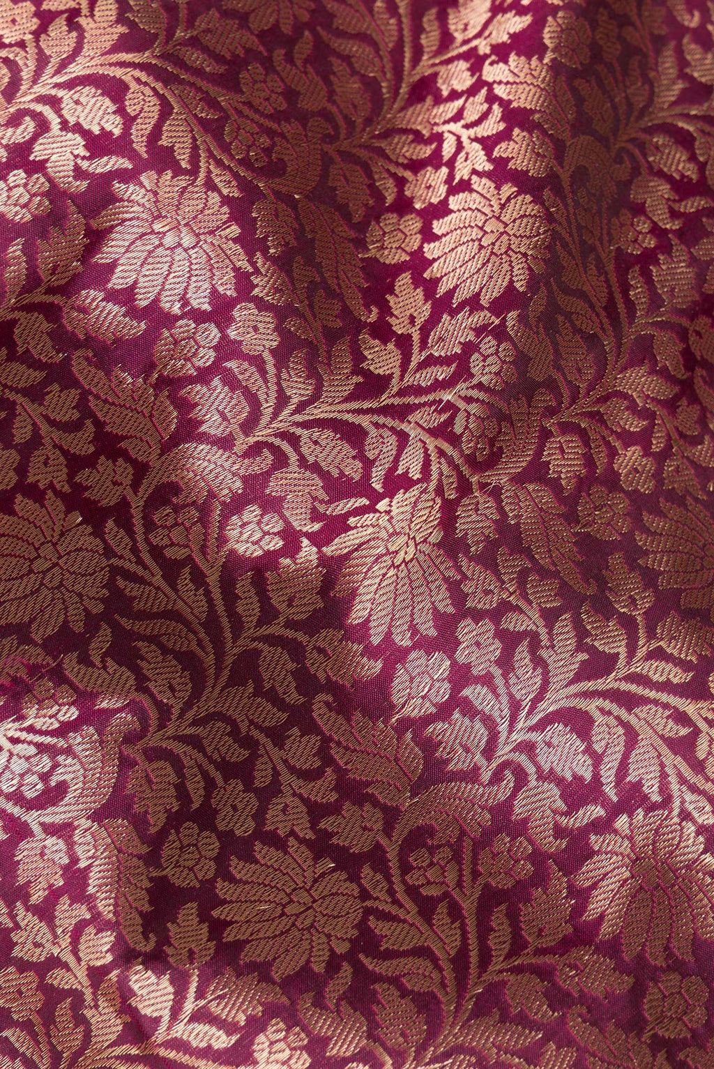 Close up of Pure Silk Burgundy Dual Tone Banarasi Saree with Zari Brocade on the body and Zari Border.  displaying folds