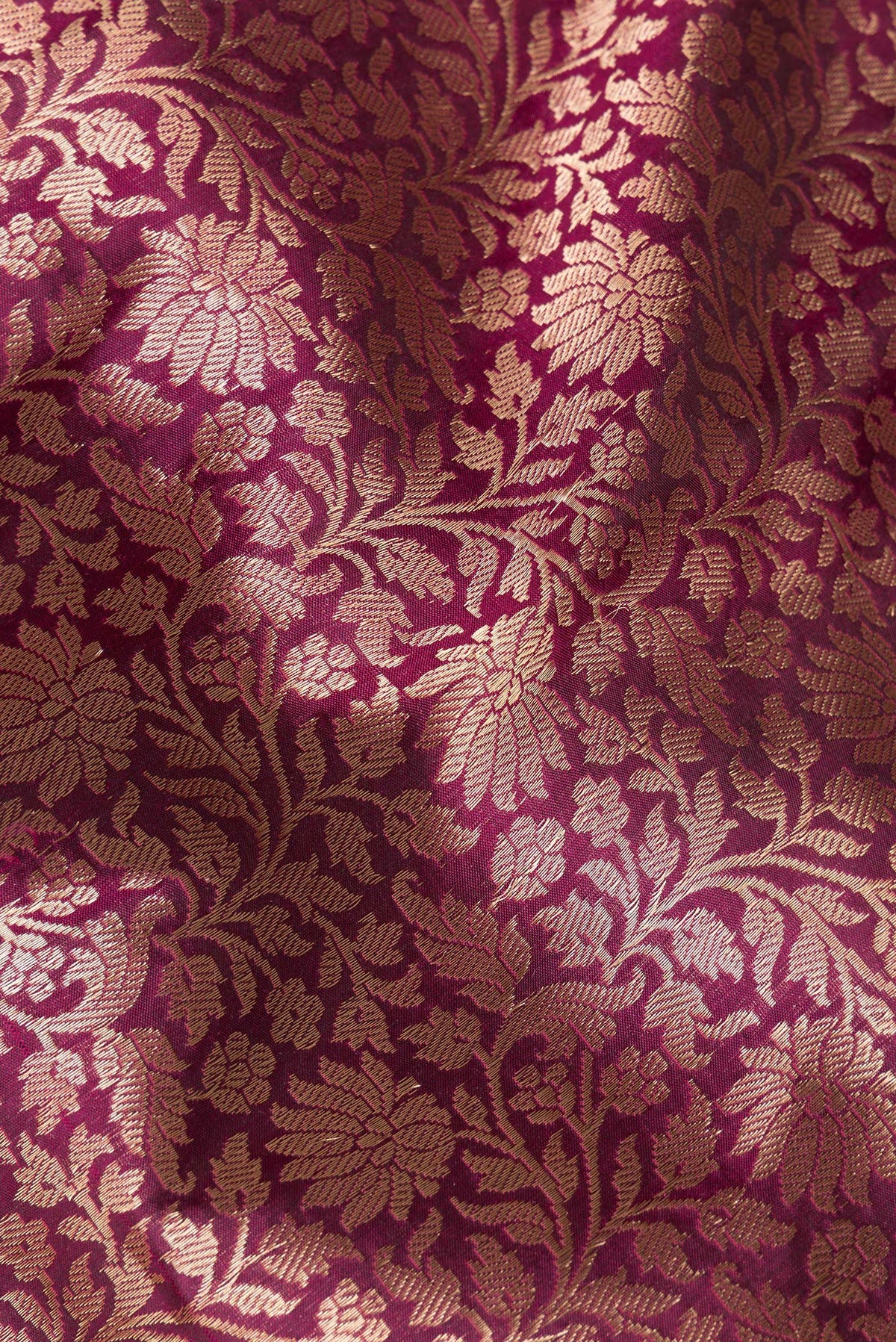 Close up of Pure Silk Burgundy Dual Tone Banarasi Saree with Zari Brocade on the body and Zari Border.  displaying folds