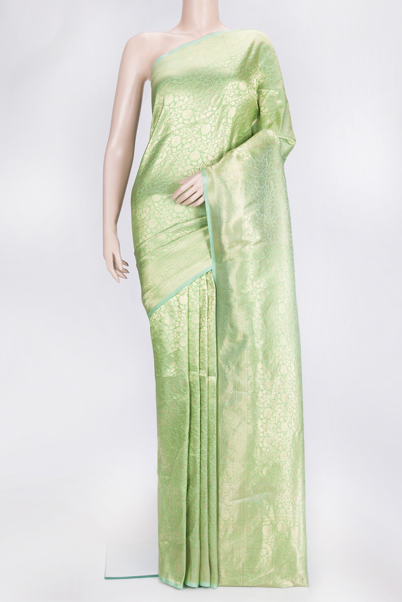 Pista Green Dual Tone Banarasi Silk Saree with Zari Brocade on the body and Zari Border.  displayed on a mannequin