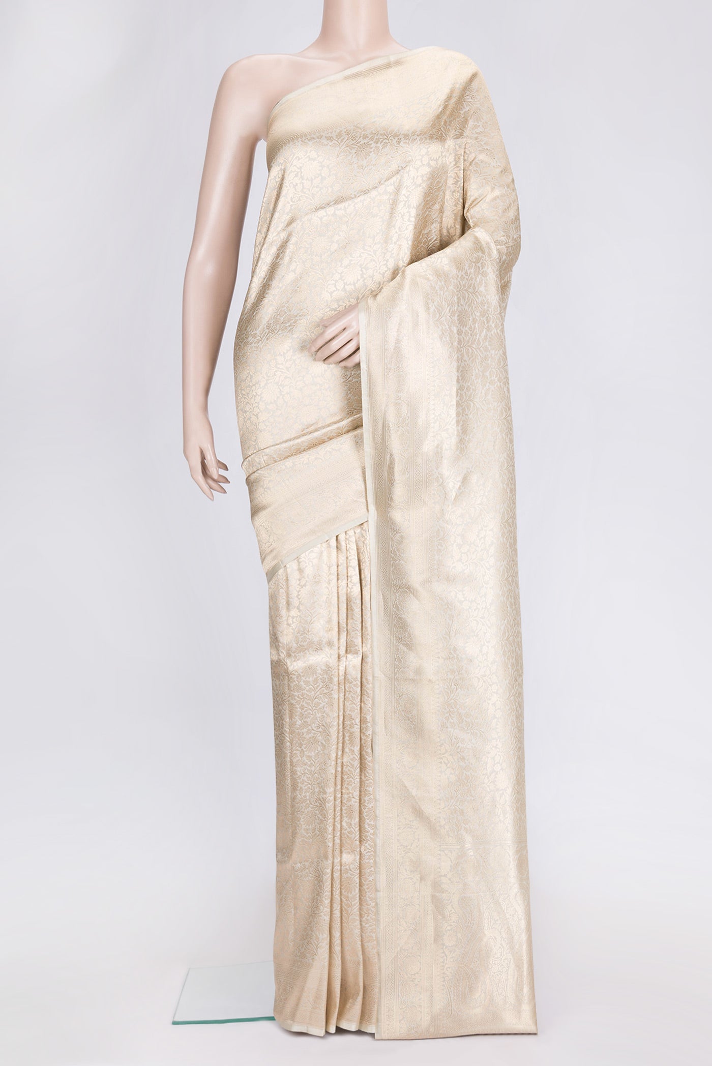 Beige Dual Tone Banarasi Silk Saree with Zari Brocade on the body and Zari Border.  displayed on a mannequin