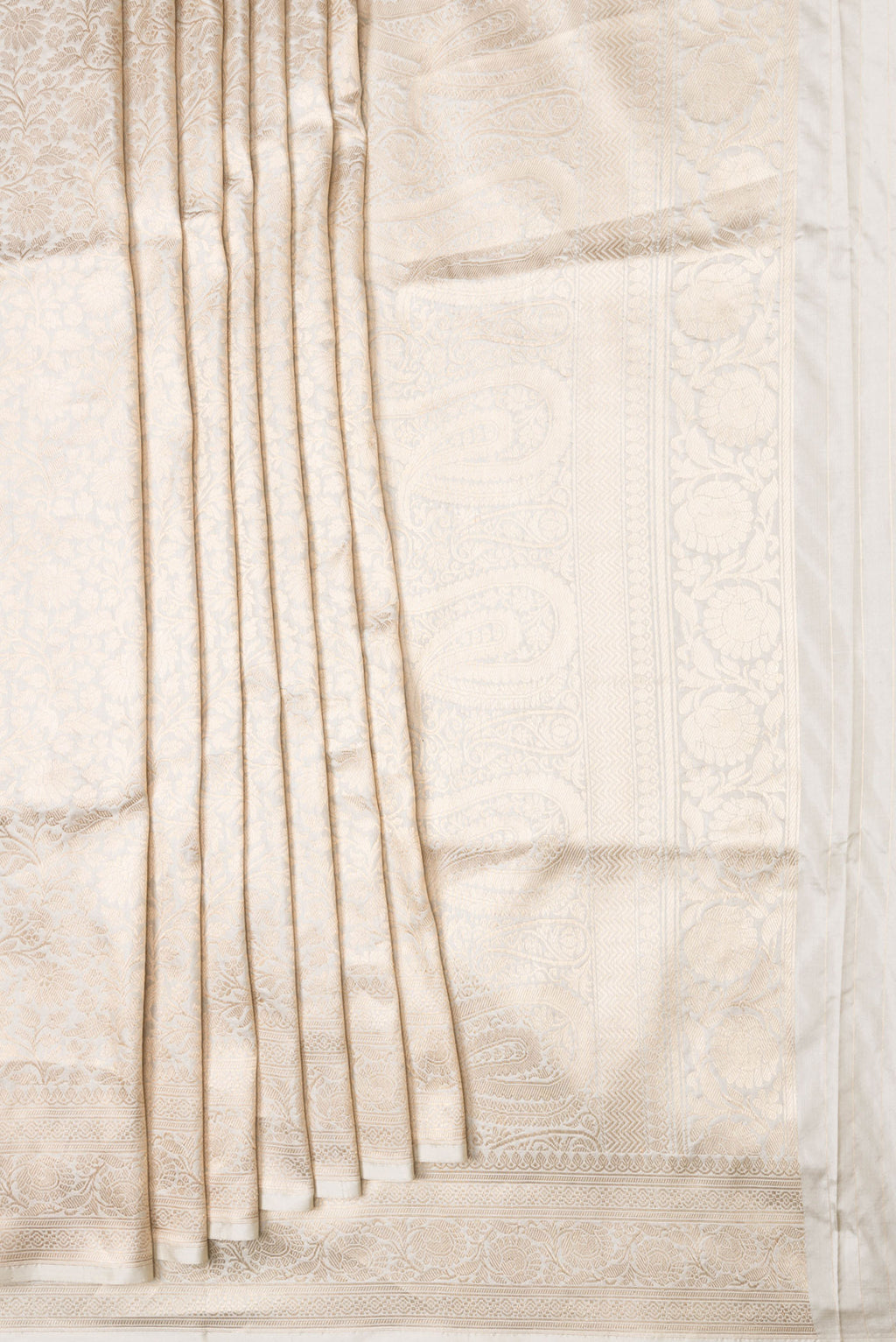 Pleats and pallu of Beige Dual Tone Banarasi Silk Saree with Zari Brocade on the body and Zari Border. 