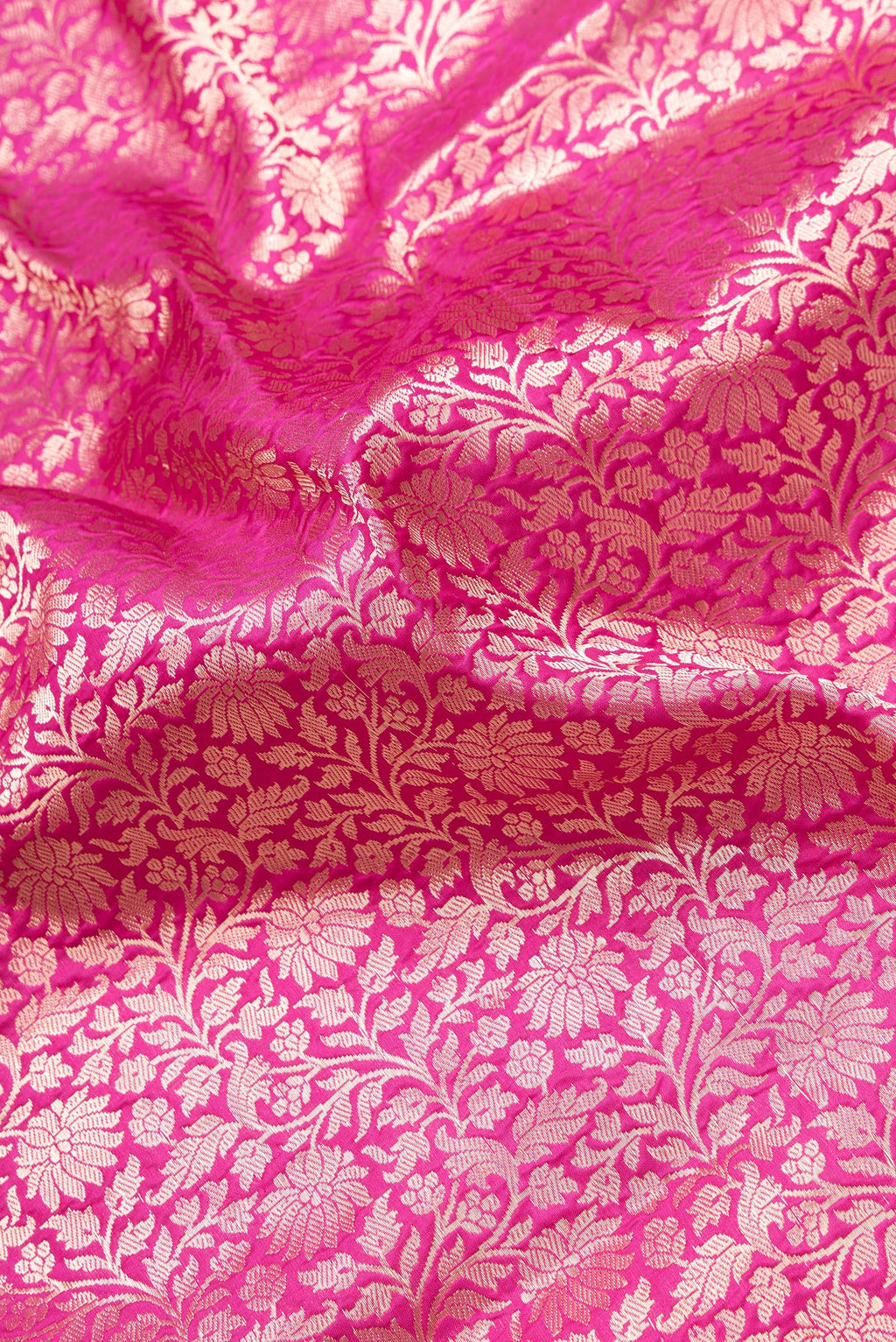Close up of Dark Pink Dual Tone Banarasi Silk Saree with Zari Brocade on the body and Zari Border.  displaying folds