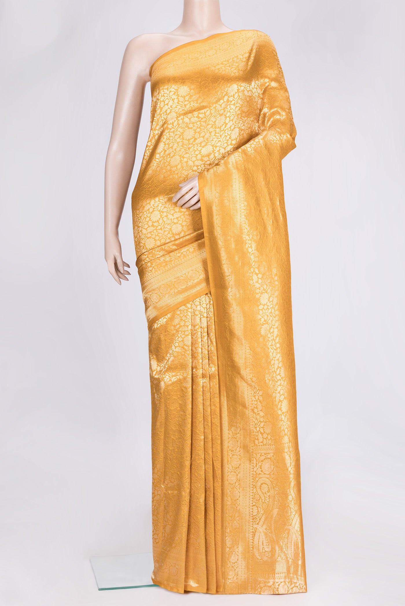Mustard Dual Tone Banarasi Silk Saree with Zari Brocade on the body and Zari Border.  displayed on a mannequin