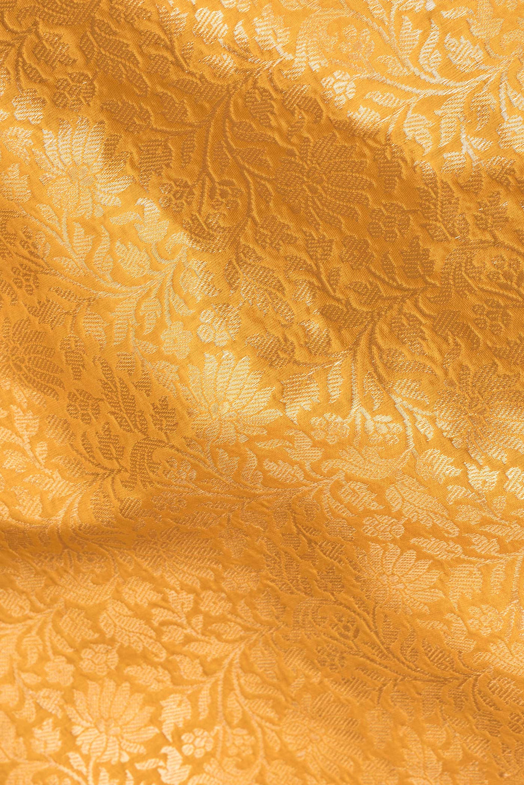 Close up of Pure Silk Mustard Banarasi Saree with Zari Brocade on the body and Zari Border.  displaying folds