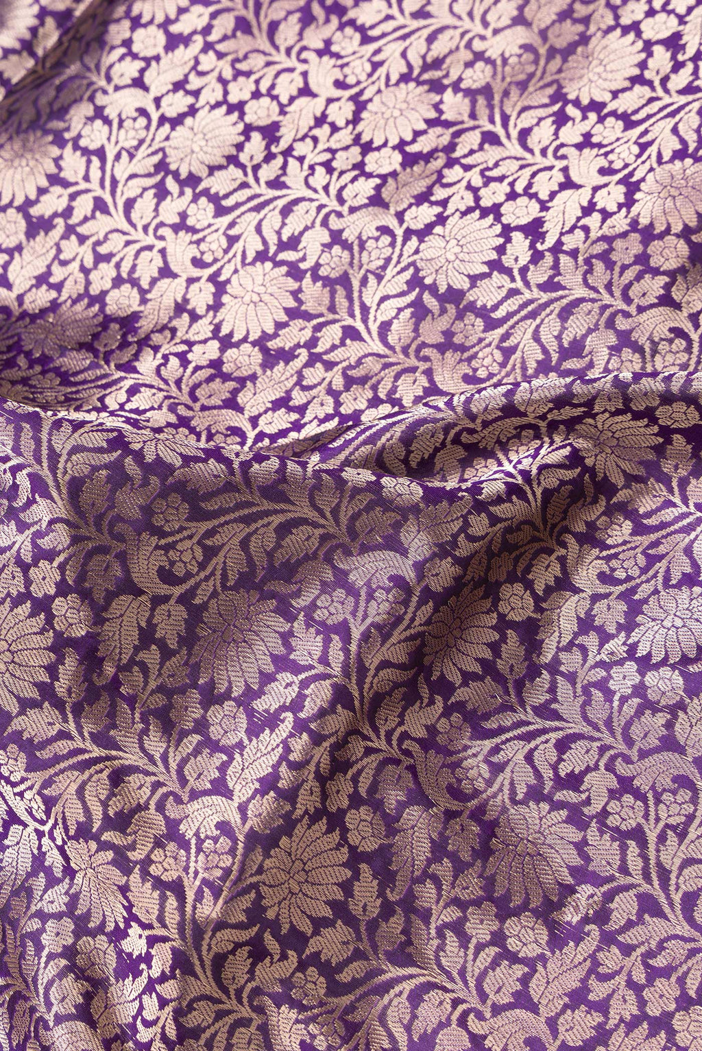 Close up of Violet Dual Tone Banarasi Silk Saree with Zari Brocade on the body and Zari Border.  displaying folds