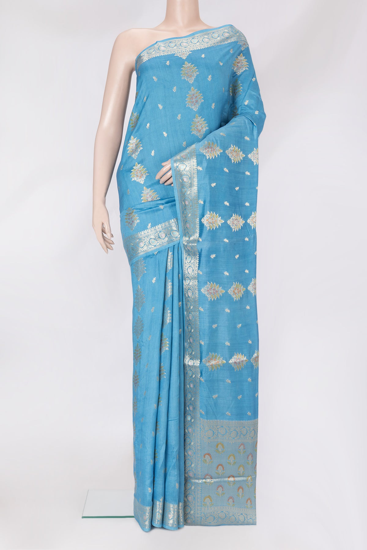 Sky Blue Dual Tone Tussar Silk Saree with Zari Butta on the body and Zari Border.  displayed on a mannequin