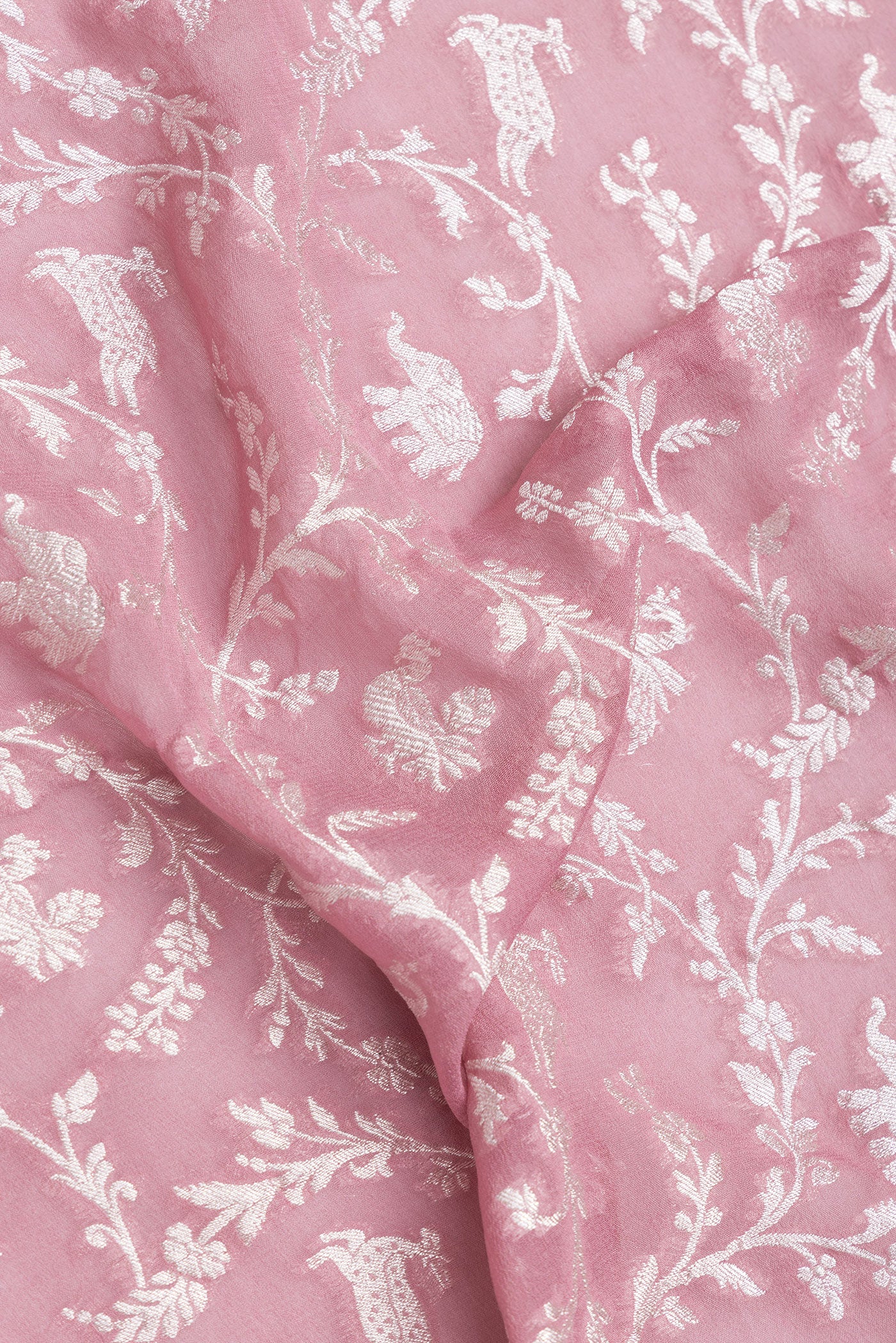 Close up of Pink Dual Tone Banarasi Georgette Saree with Zari Brocade on the body and Zari Border.  displaying folds