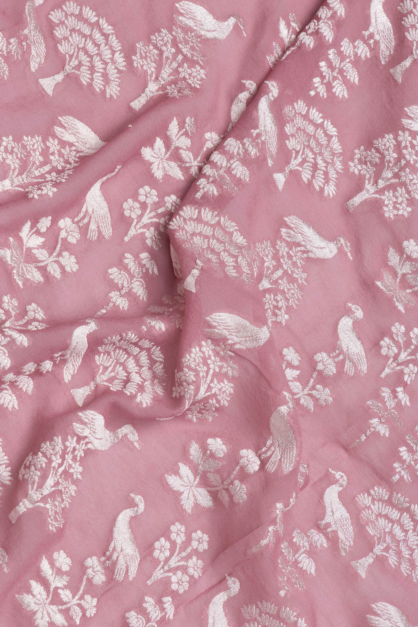 Close up of Pink Dual Tone Banarasi Georgette Saree with Zari Brocade on the body and Zari Border.  displaying folds