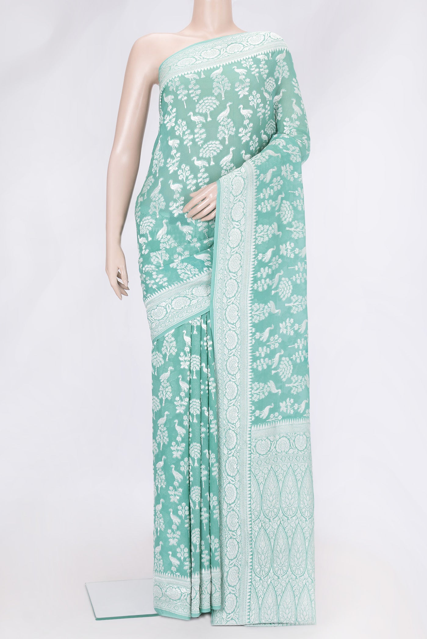 Sea Green Dual Tone Banarasi Georgette Saree with Zari Brocade on the body and Zari Border.  displayed on a mannequin