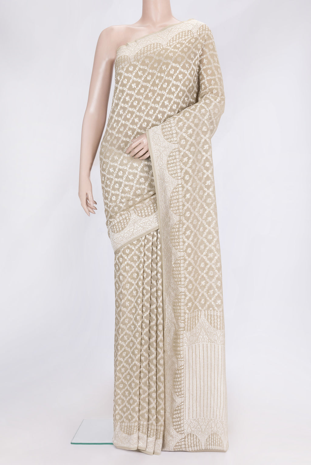 Beige Dual Tone Banarasi Georgette Saree with Zari Brocade on the body and Zari Border.  displayed on a mannequin