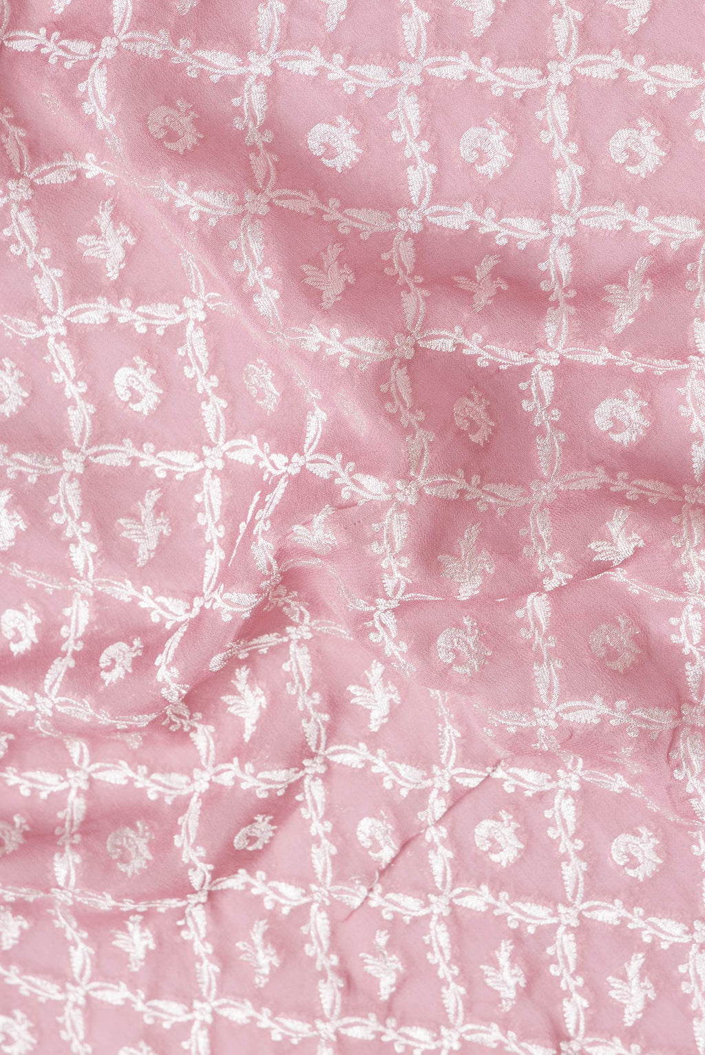 Close up of Pink Dual Tone Banarasi Georgette Saree with Zari Brocade on the body and Zari Border.  displaying folds