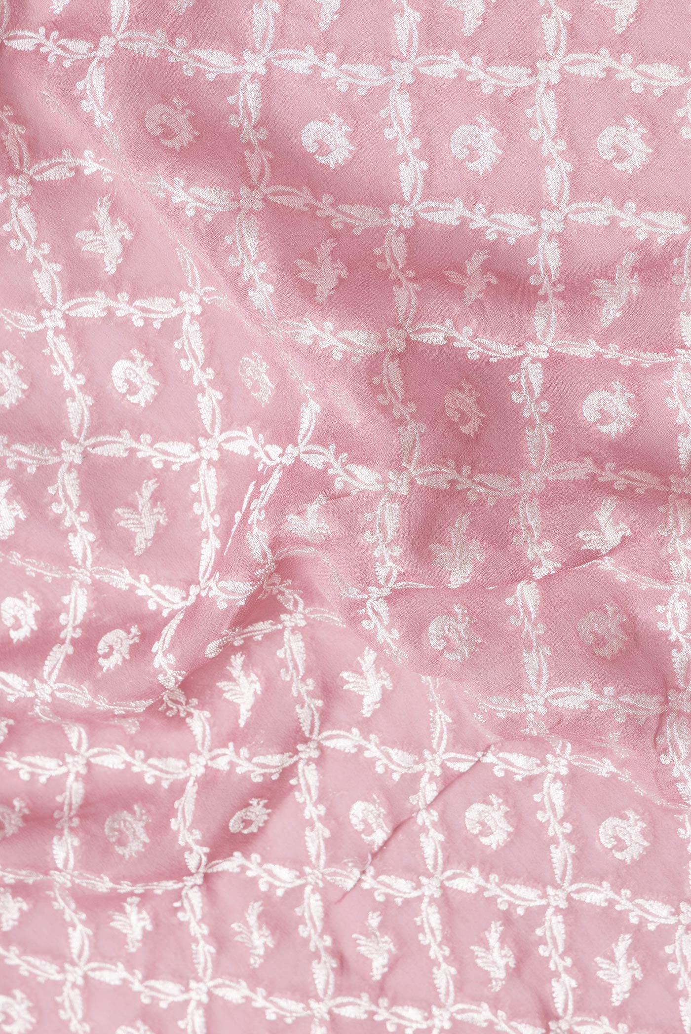 Close up of Pink Dual Tone Banarasi Georgette Saree with Zari Brocade on the body and Zari Border.  displaying folds