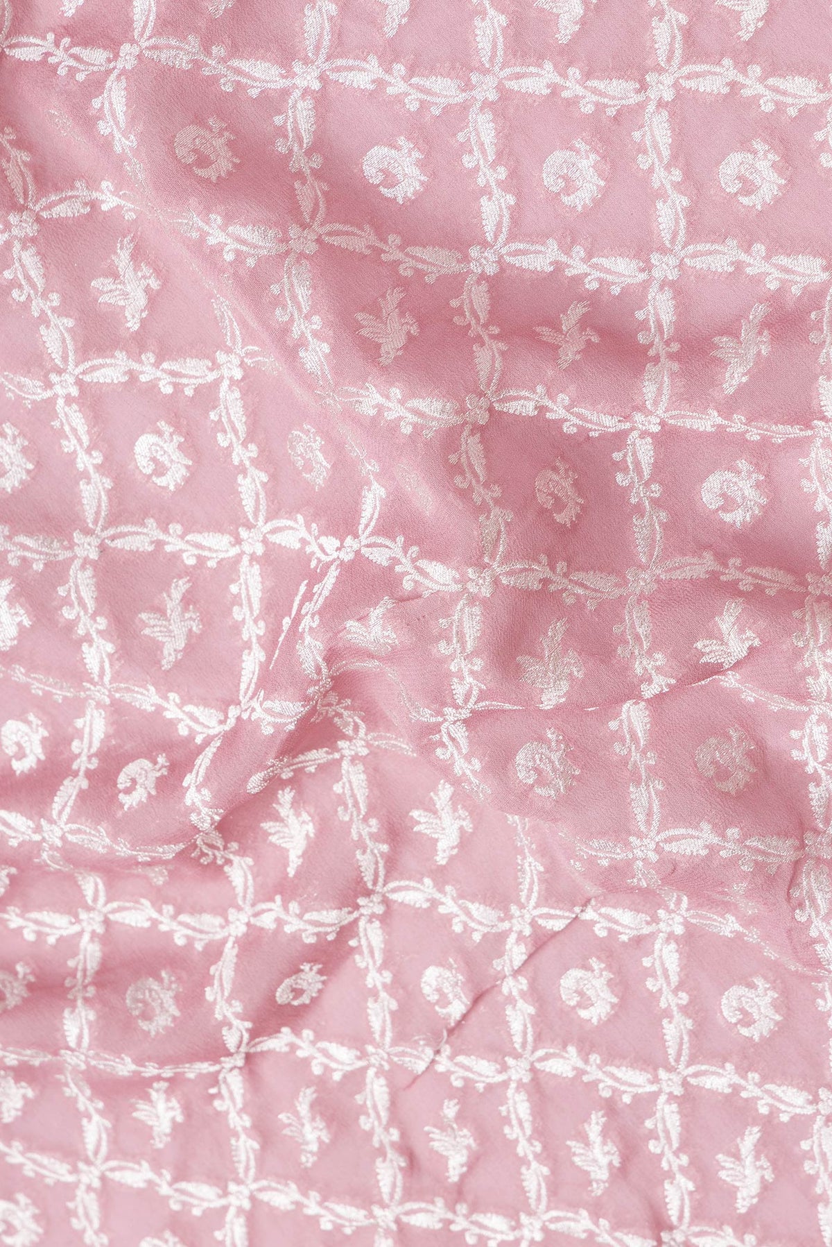 Close up of Pink Dual Tone Banarasi Georgette Saree with Zari Brocade on the body and Zari Border.  displaying folds