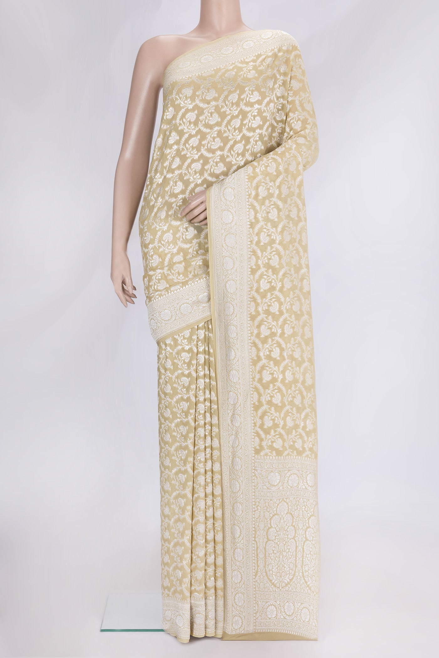 Sandal Dual Tone Banarasi Georgette Saree with Zari Brocade on the body and Zari Border.  displayed on a mannequin