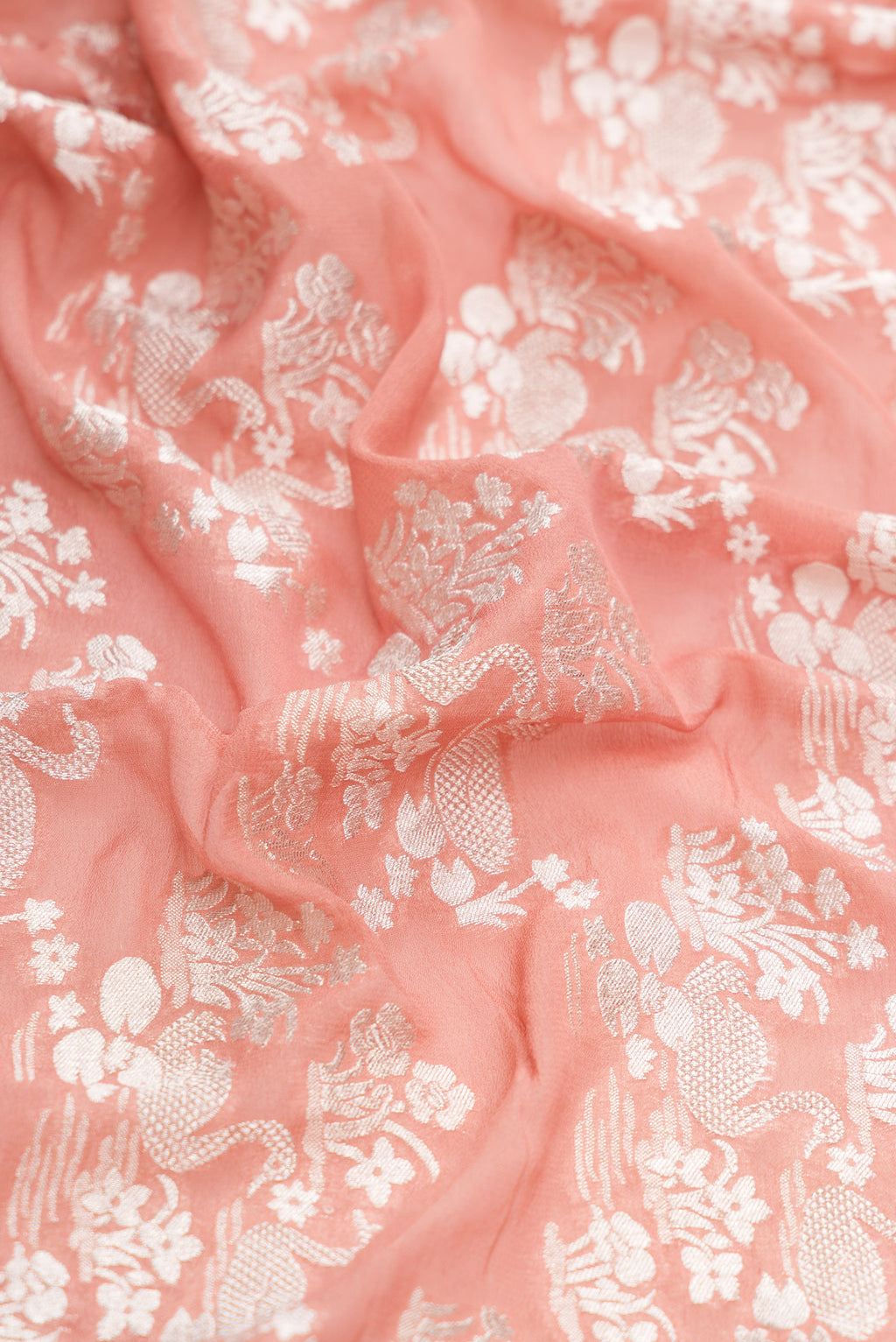 Close up of Brown Dual Tone Mysore Georgette Saree with Zari Brocade on the body and Zari Border.  displaying folds