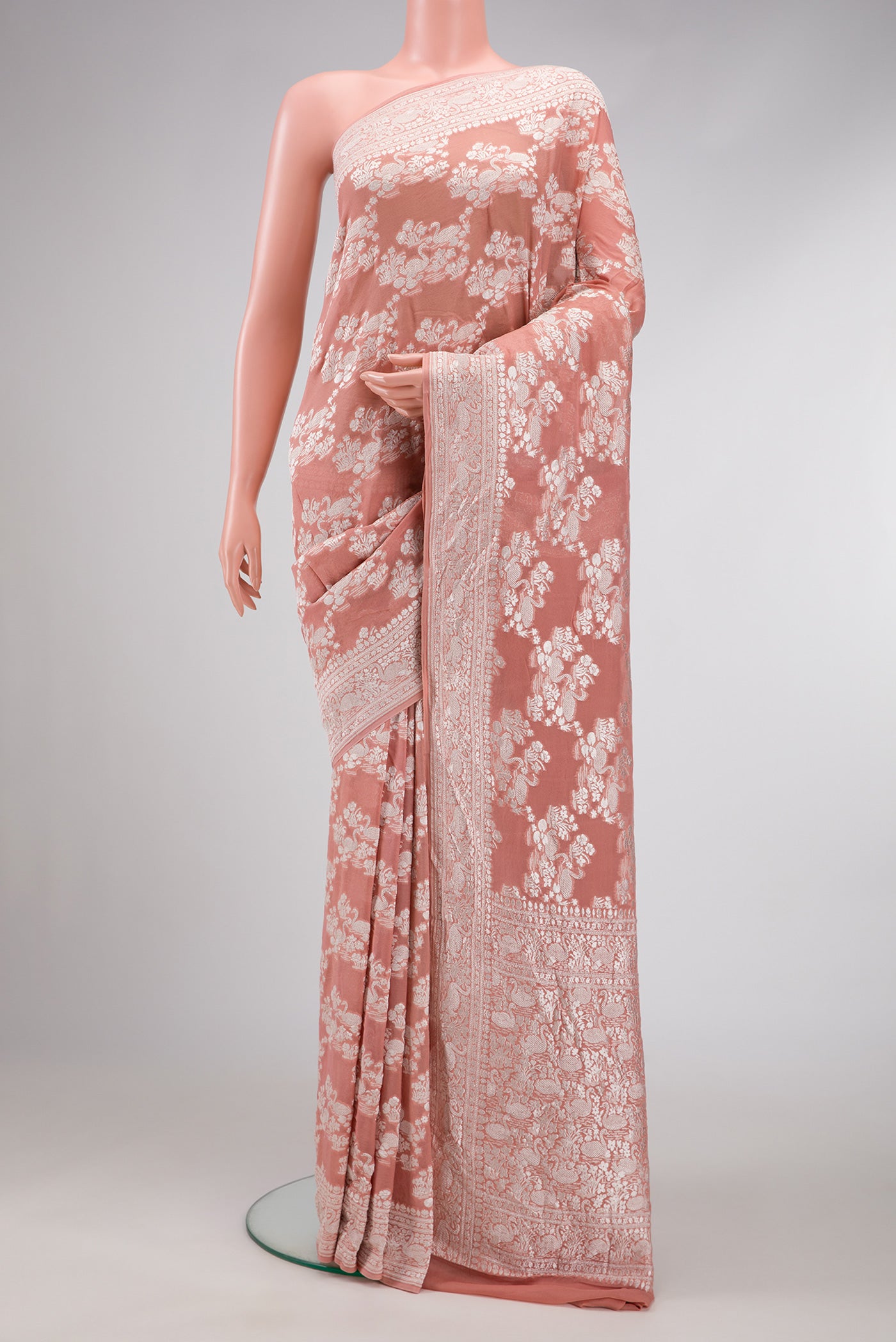 Brown Dual Tone Mysore Georgette Saree with Zari Brocade on the body and Zari Border.  displayed on a mannequin