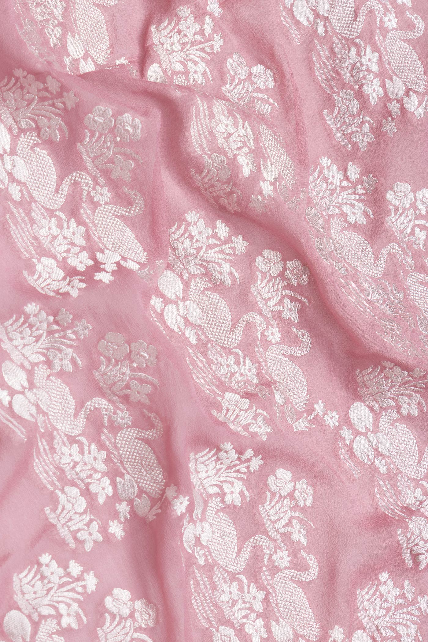 Close up of Pink Dual Tone Banarasi Georgette Saree with Zari Brocade on the body and Zari Border.  displaying folds