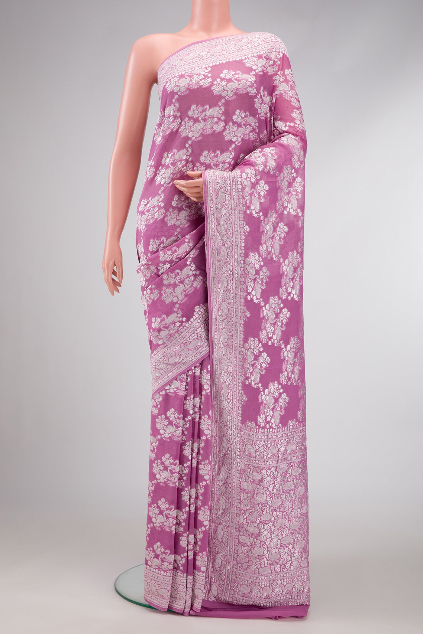 Lavender Dual Tone Mysore Georgette Saree with Zari Brocade on the body and Zari Border.  displayed on a mannequin