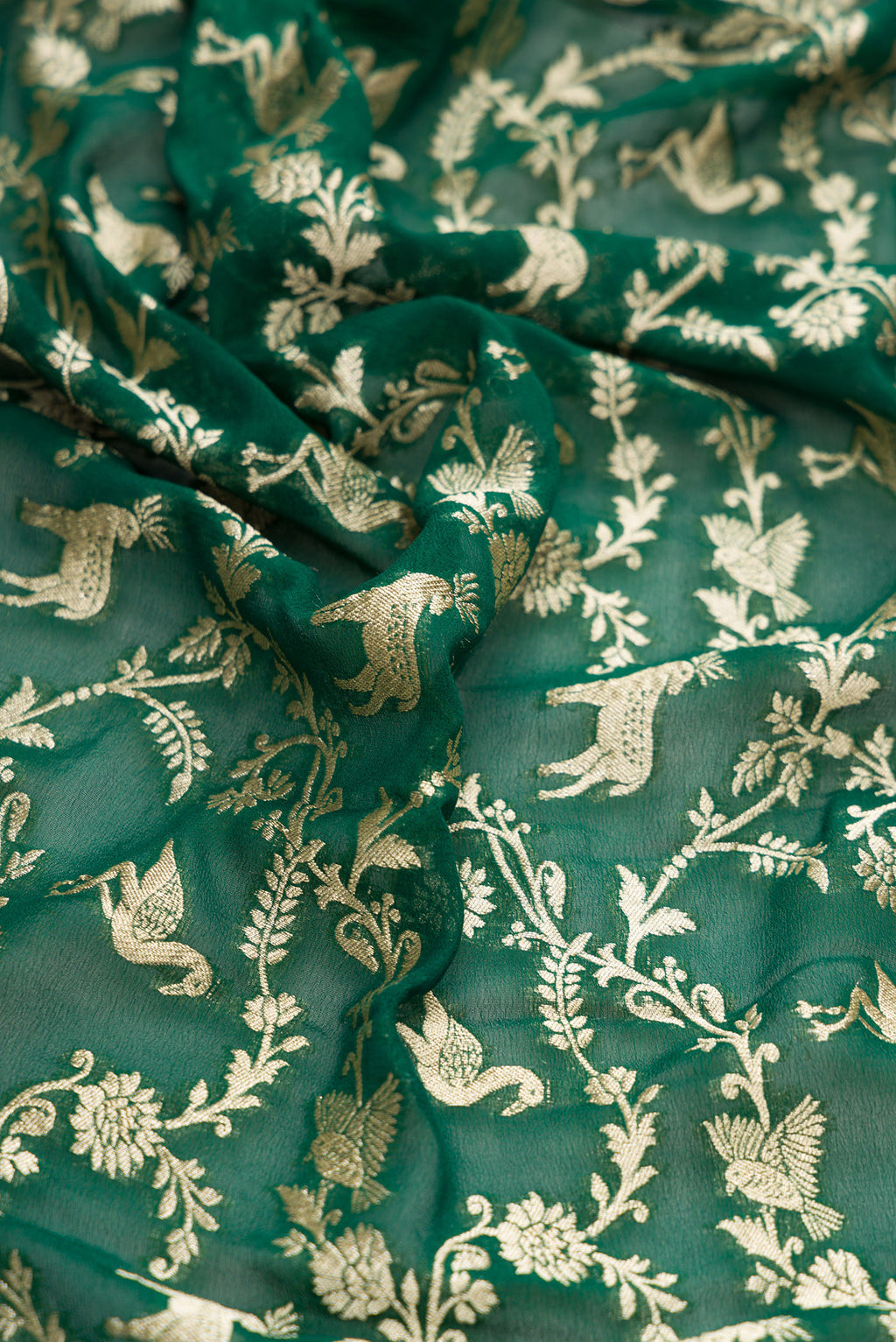 Close up of Bottle Green Dual Tone Mysore Georgette Saree with Zari Brocade on the body and Zari Border.  displaying folds