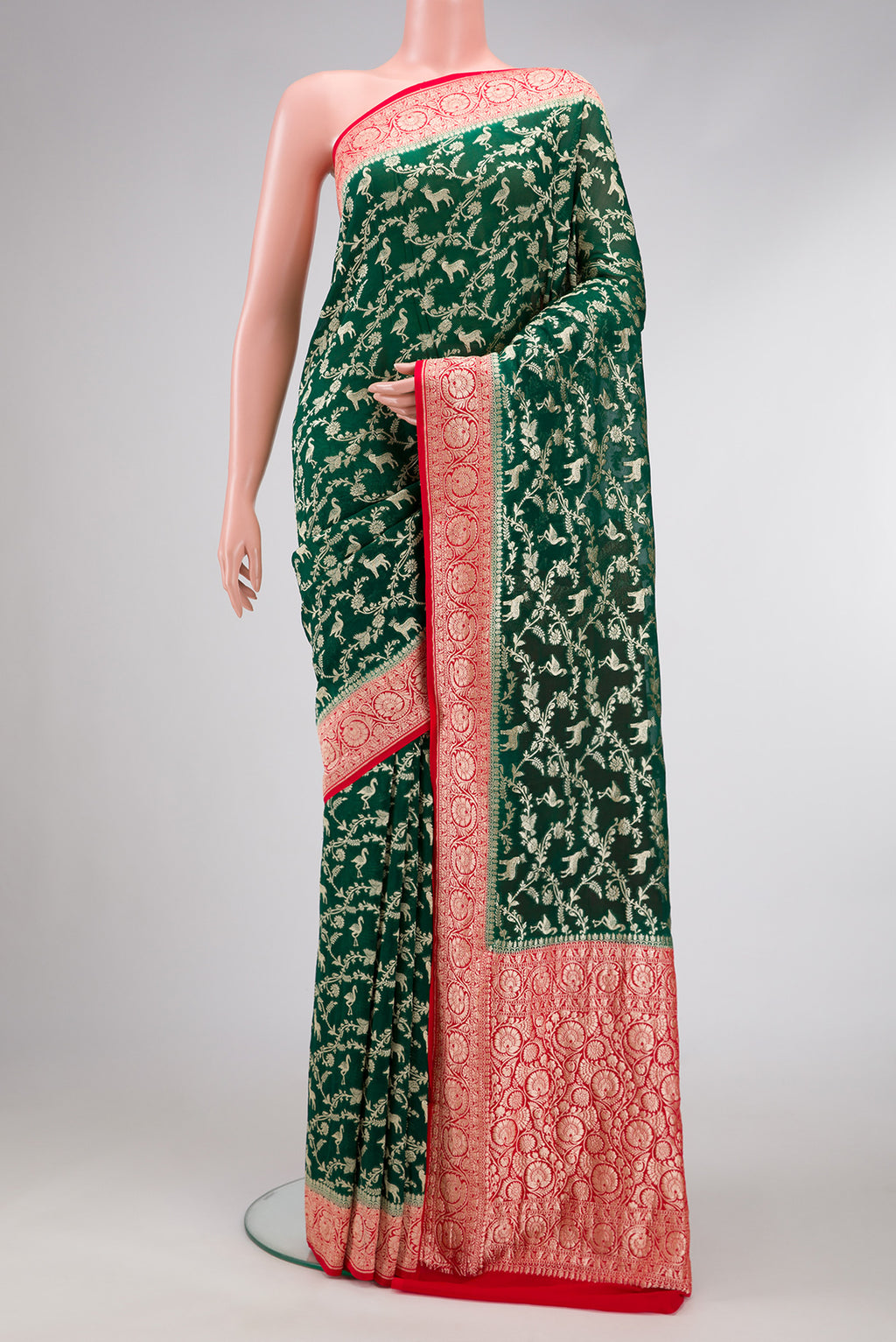 Bottle Green Dual Tone Mysore Georgette Saree with Zari Brocade on the body and Zari Border.  displayed on a mannequin