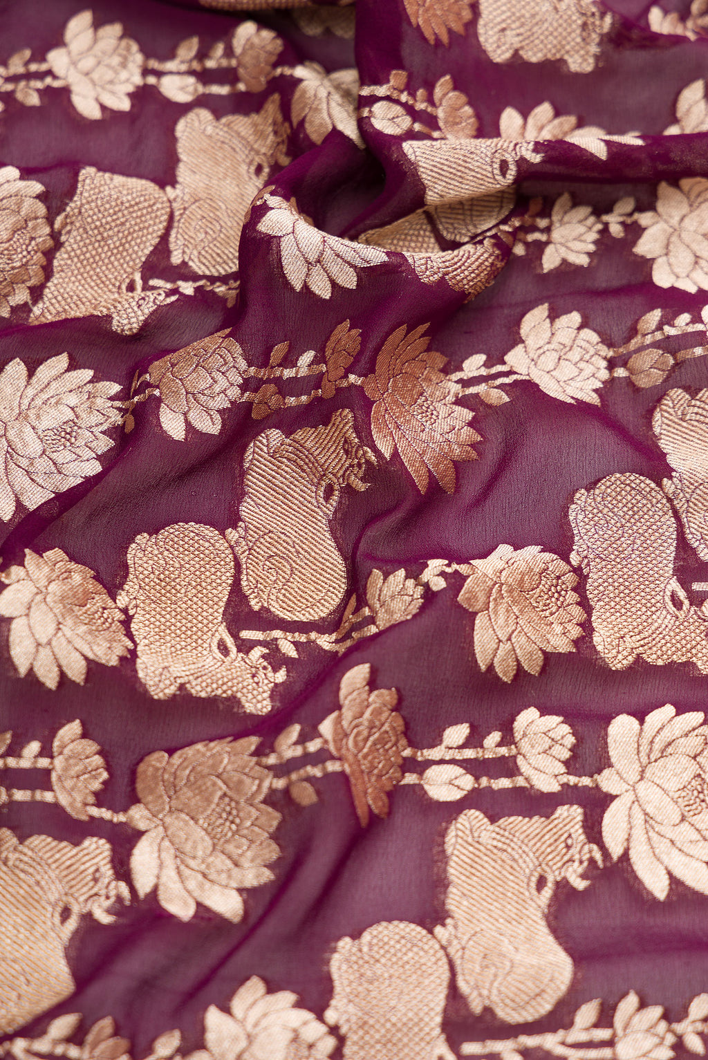 Close up of Burgundy Dual Tone Mysore Georgette Saree with Zari Brocade on the body and Zari Border.  displaying folds