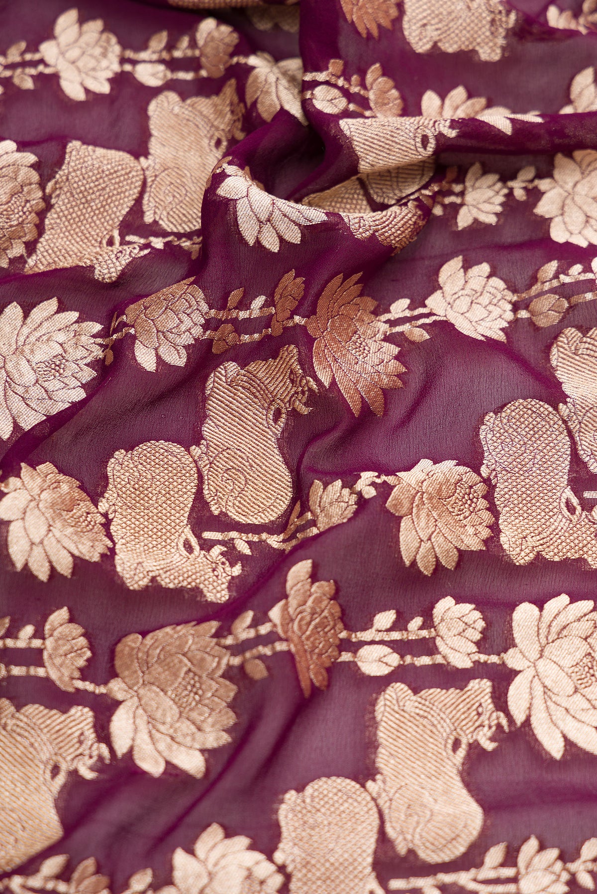 Close up of Burgundy Dual Tone Mysore Georgette Saree with Zari Brocade on the body and Zari Border.  displaying folds