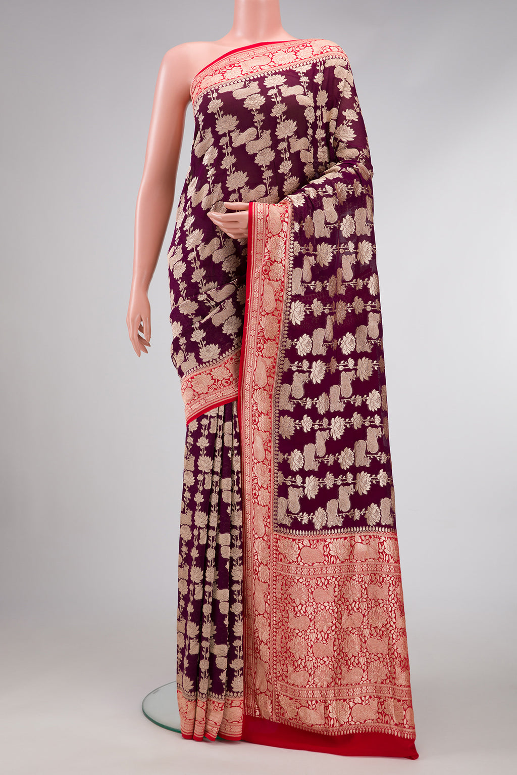 Burgundy Dual Tone Mysore Georgette Saree with Zari Brocade on the body and Zari Border.  displayed on a mannequin