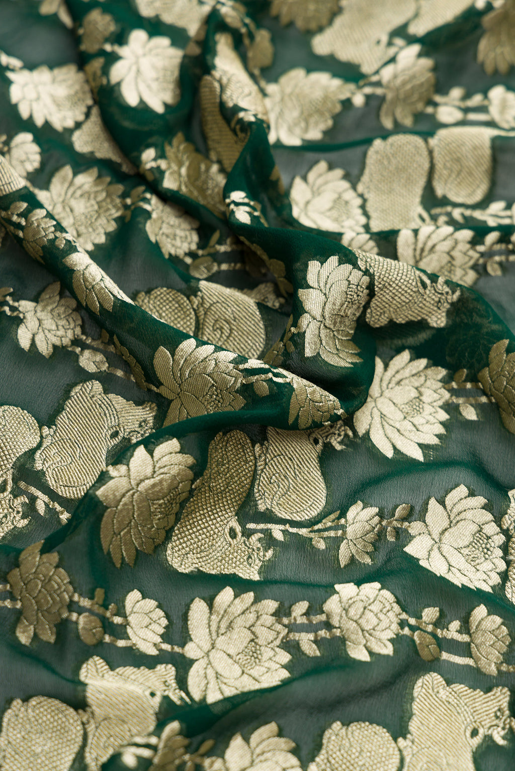 Close up of Bottle Green Dual Tone Mysore Georgette Saree with Zari Brocade on the body and Zari Border.  displaying folds