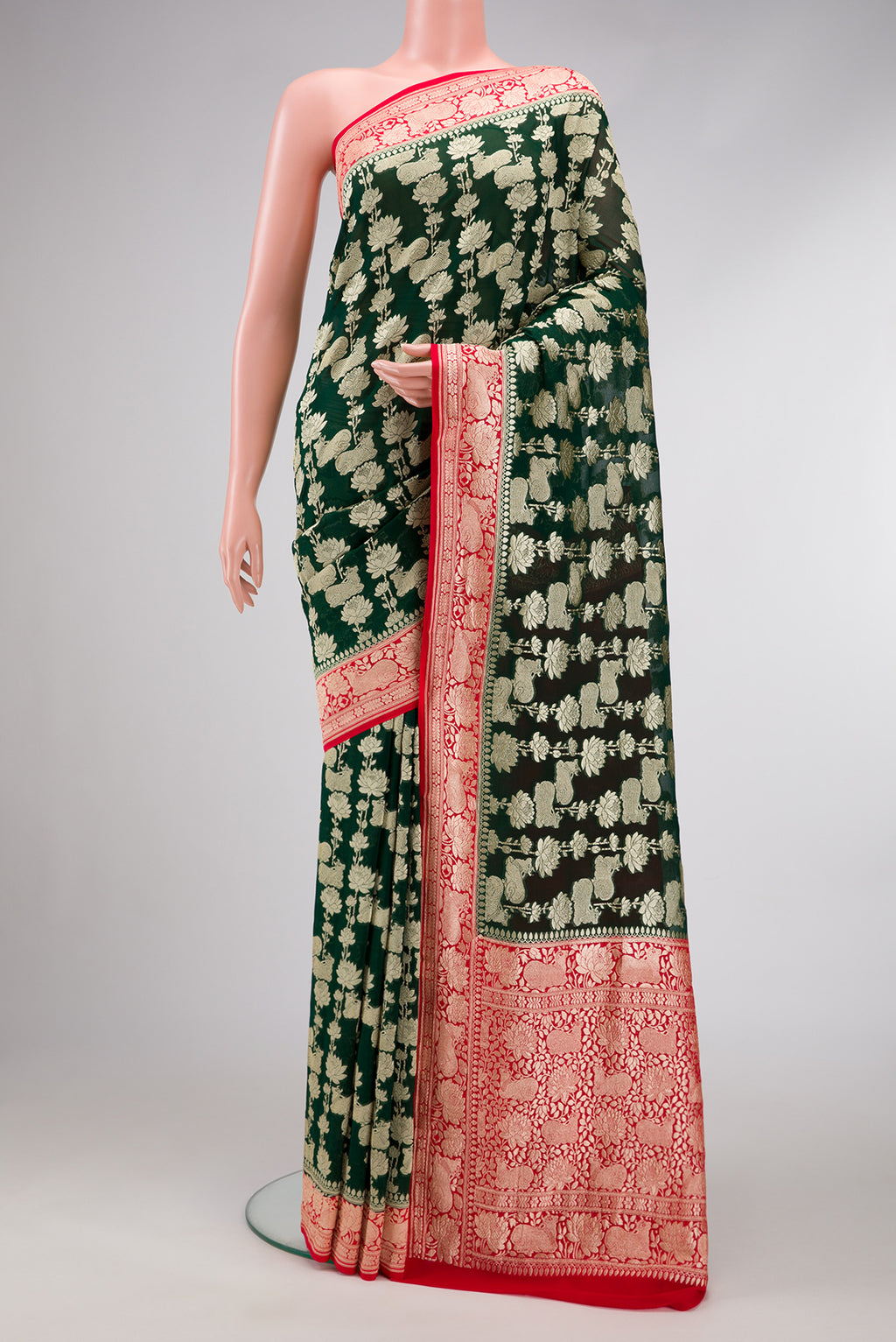 Bottle Green Dual Tone Mysore Georgette Saree with Zari Brocade on the body and Zari Border.  displayed on a mannequin