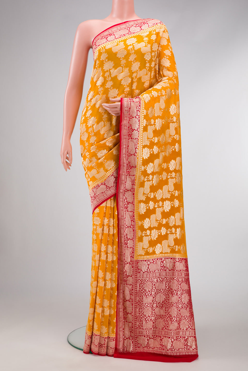 Mustard Dual Tone Mysore Georgette Saree with Zari Brocade on the body and Zari Border.  displayed on a mannequin