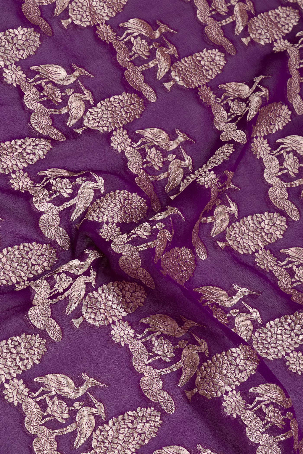 Close up of Violet Banarasi Georgette Saree with Zari Brocade on the body and Zari Border.  displaying folds
