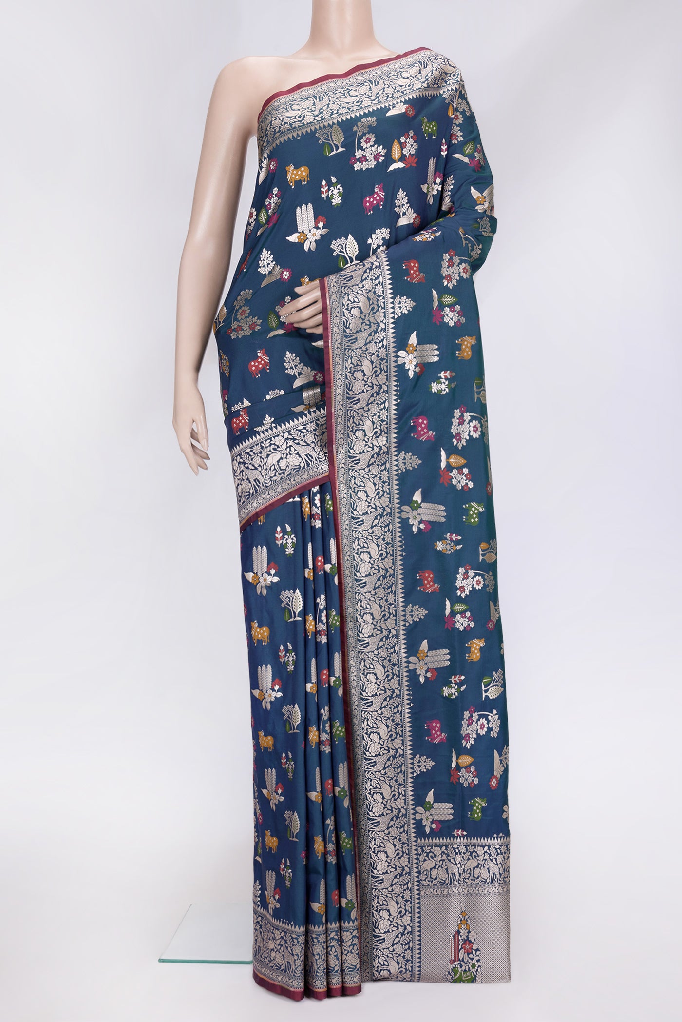 Peacock Blue Dual Tone Blended Banarasi Silk Saree with Zari Brocade on the body and Zari Border.  displayed on a mannequin