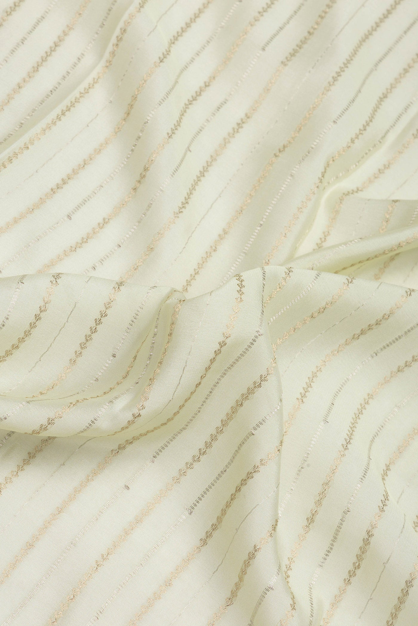 Close up of Off White Mysore Crepe Saree with Stripes on the body and Zari Border.  displaying folds