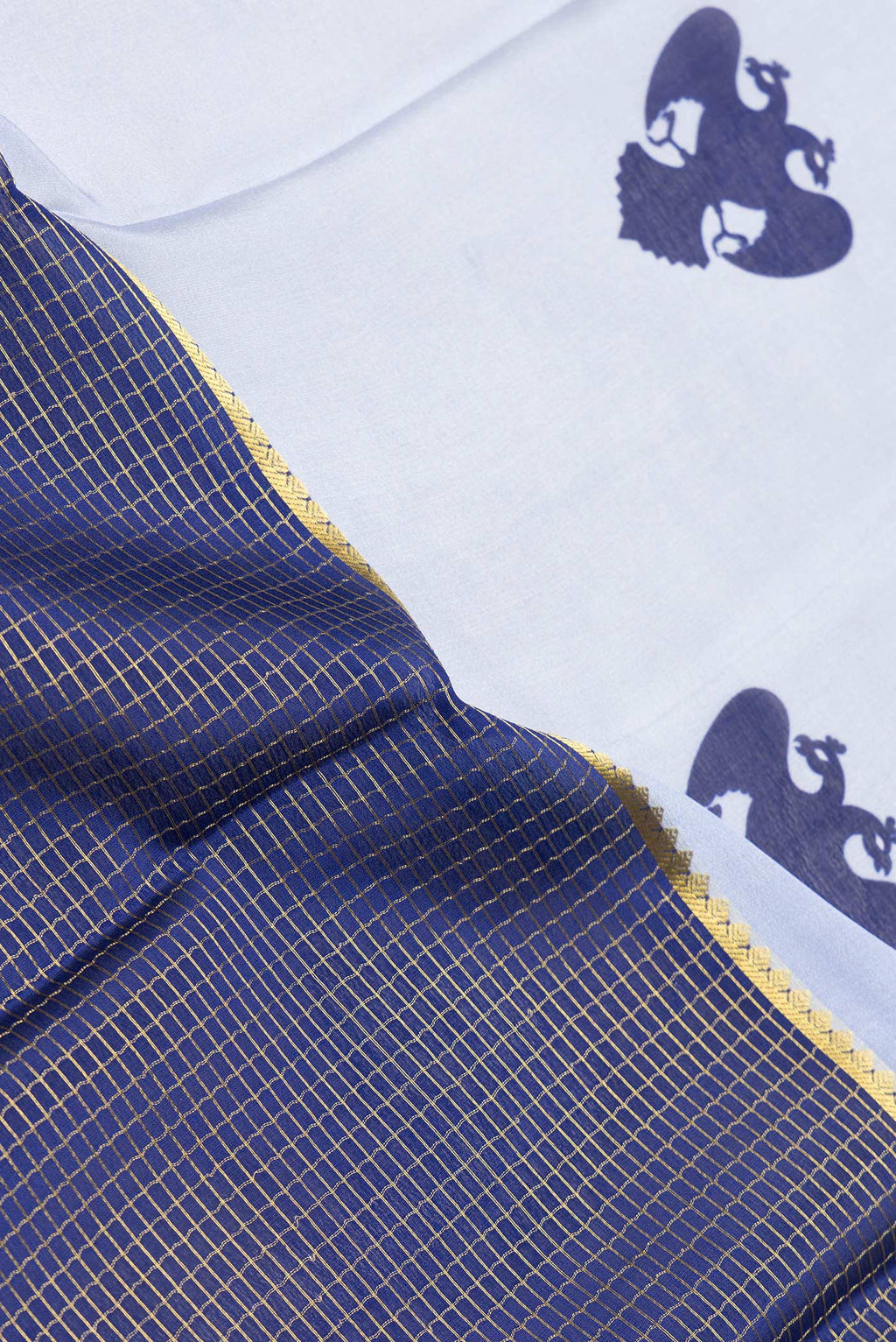 Close up of Grey and Navy Blue Color Mysore Silk Saree with Half And Half on the body and Zari Border.  displaying folds