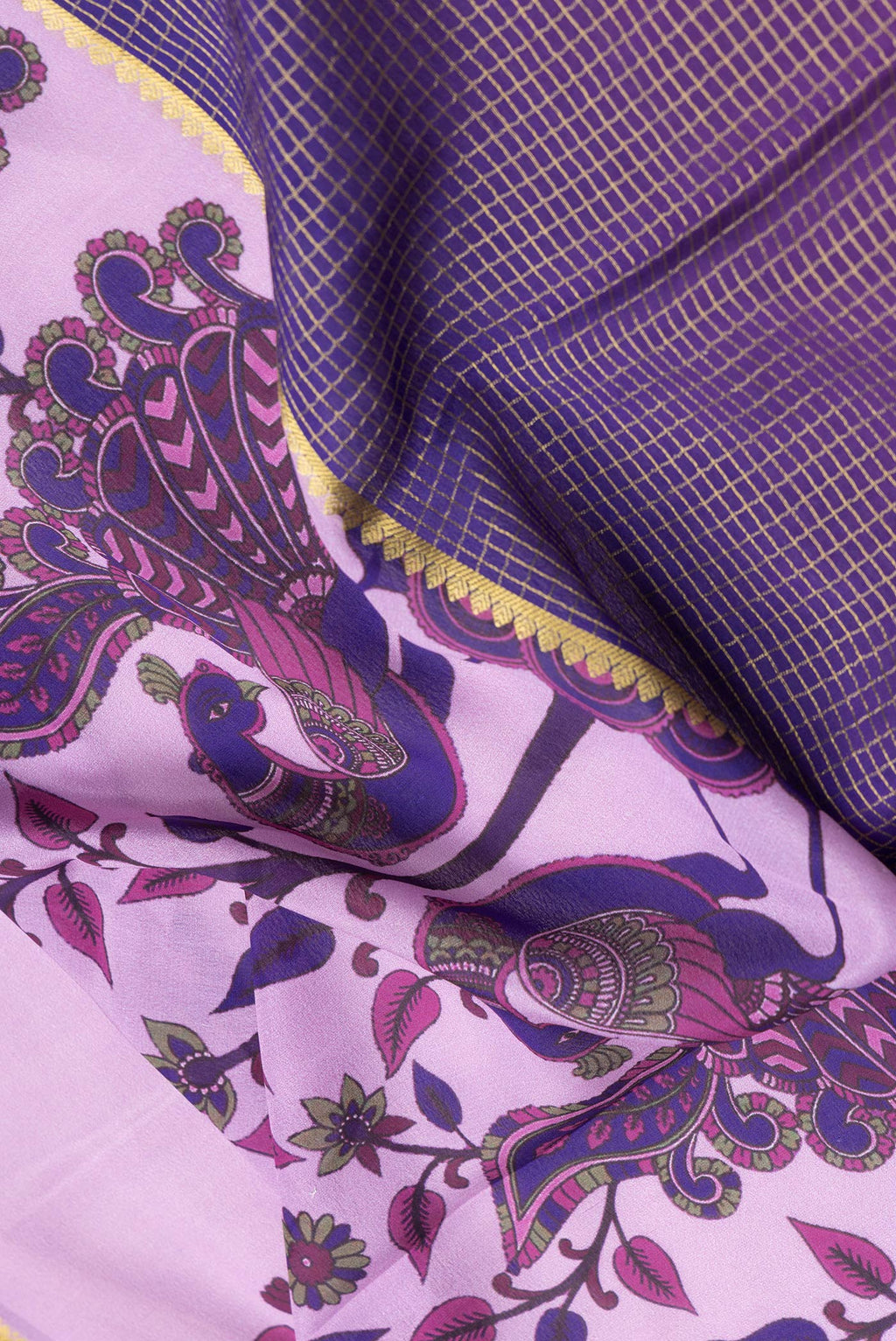 Close up of Purple and Pink Color Mysore Silk Saree with Half And Half on the body and Zari Border.  displaying folds