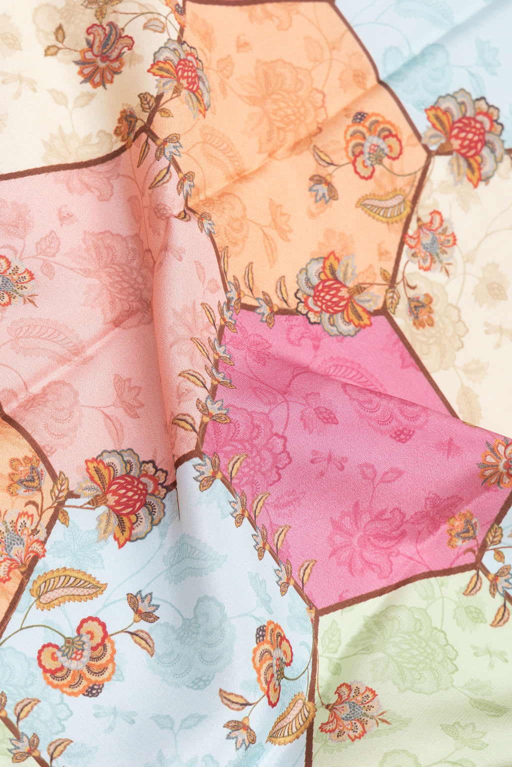 Close up of Multi Color Mysore Silk Saree with Printed design on the body and Zari Border.  displaying folds