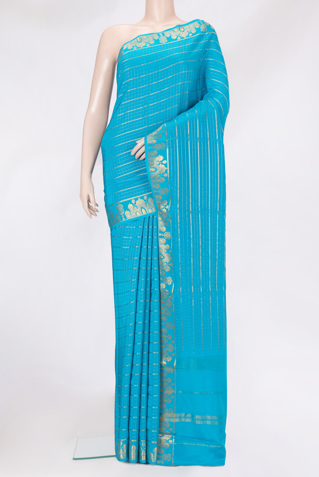 Sky Blue Mysore Silk Saree with Checked design on the body and Zari Border.  displayed on a mannequin