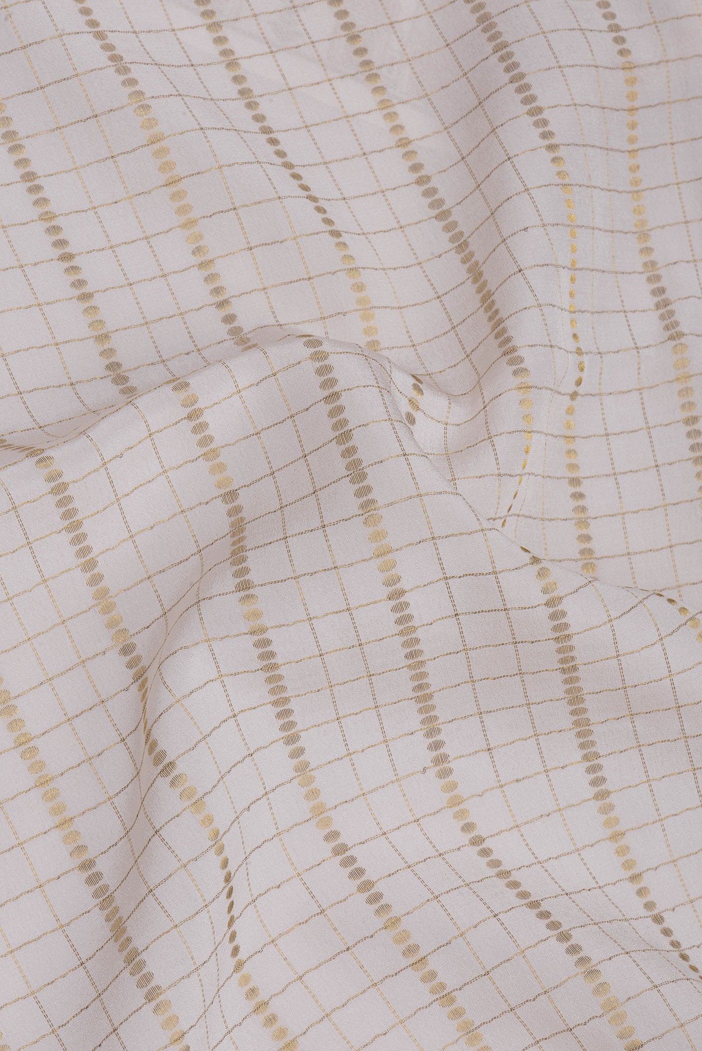 Close up of Off White Mysore Silk Saree with Checked design on the body and Zari Border.  displaying folds